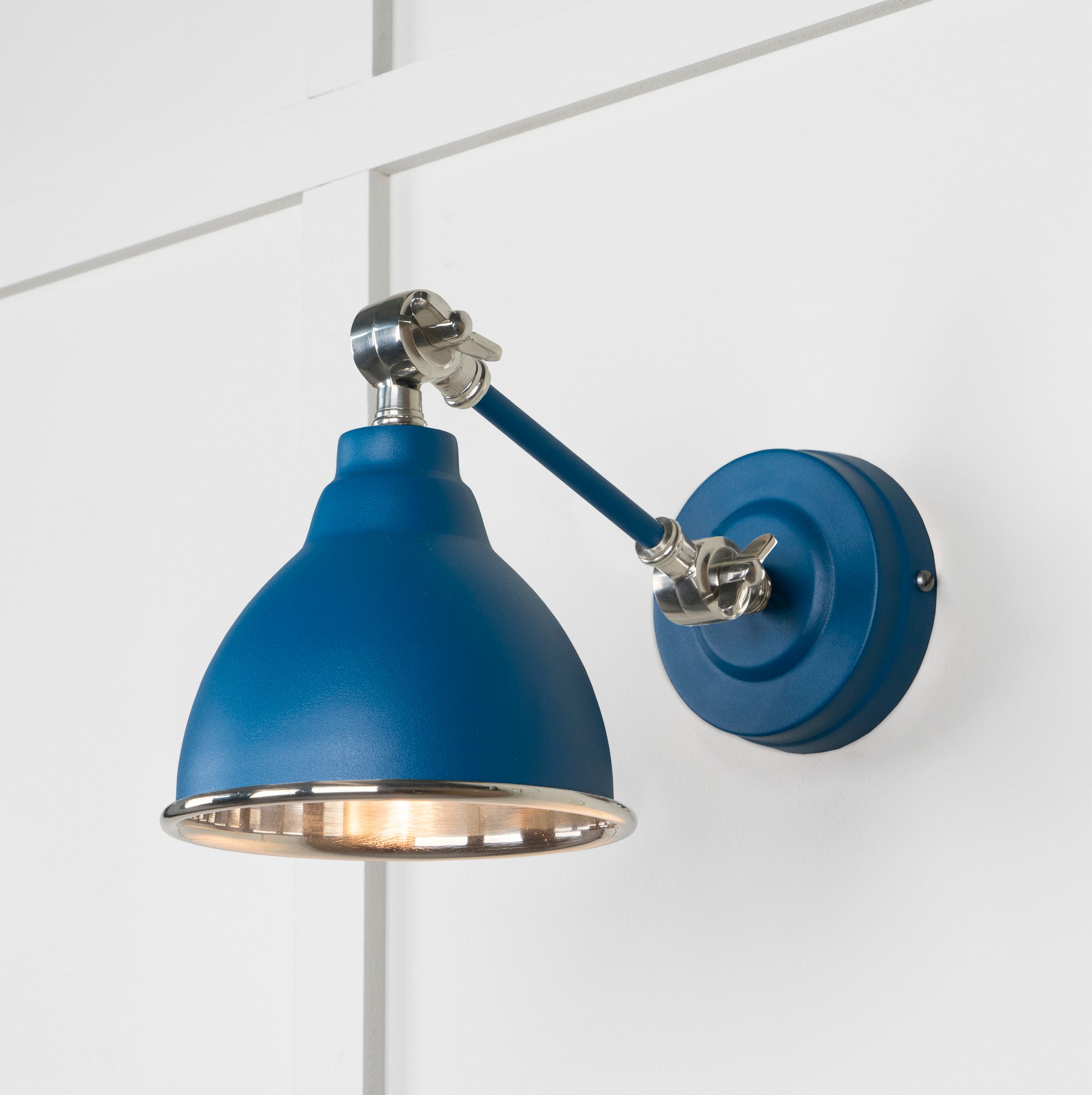 Smooth Nickel Brindley Wall Light Upstream, Front Side with light on.