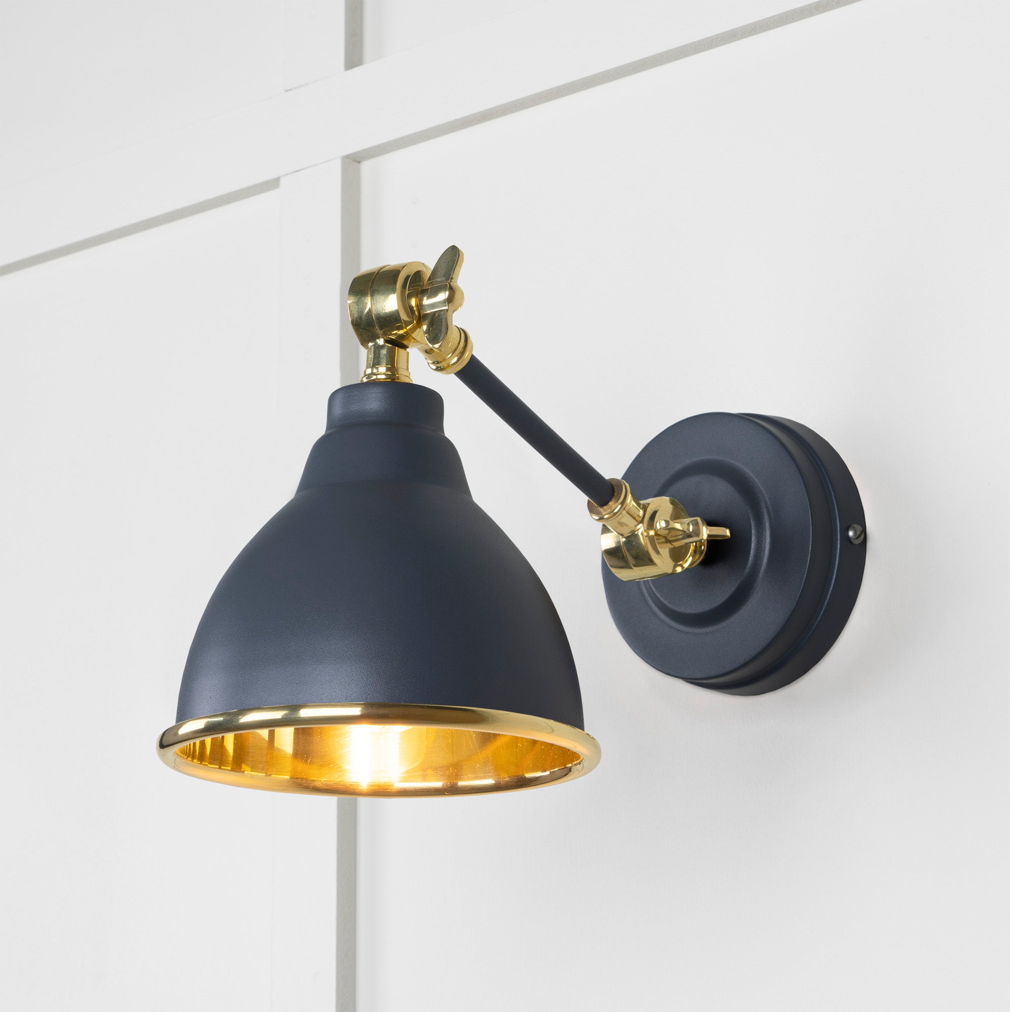 Smooth Brass Brindley Wall Light Slate, Front Side with light on.