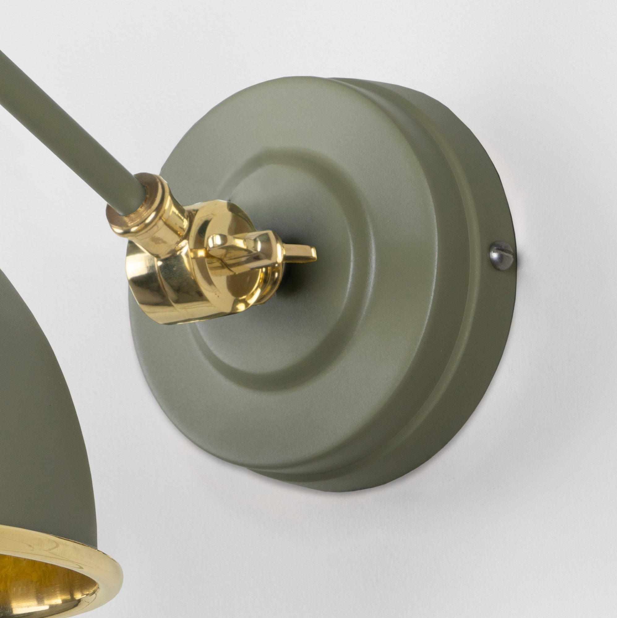 Smooth Brass Brindley Wall Light Tump, close up view of fitting and cable.