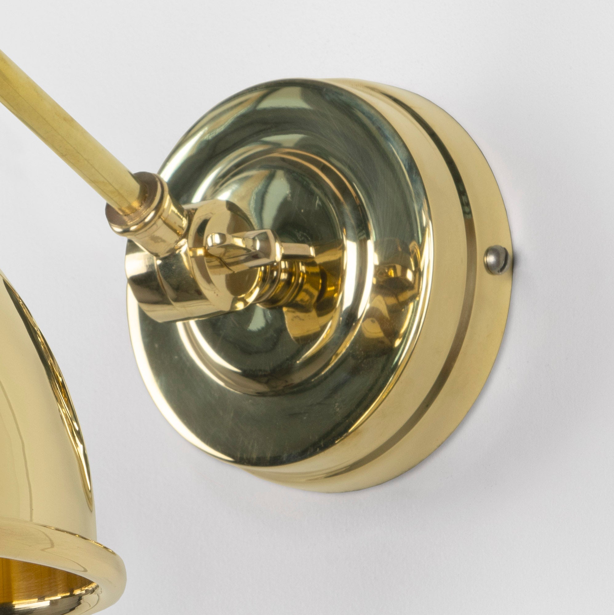 Smooth Brass Brindley Wall Light , close up view of fitting and cable.