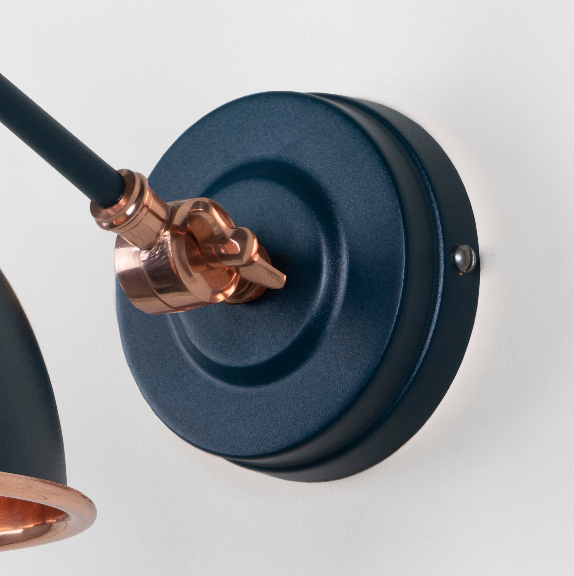 Hammered Copper Brindley Wall Light Dusk, close up view of fitting and cable.