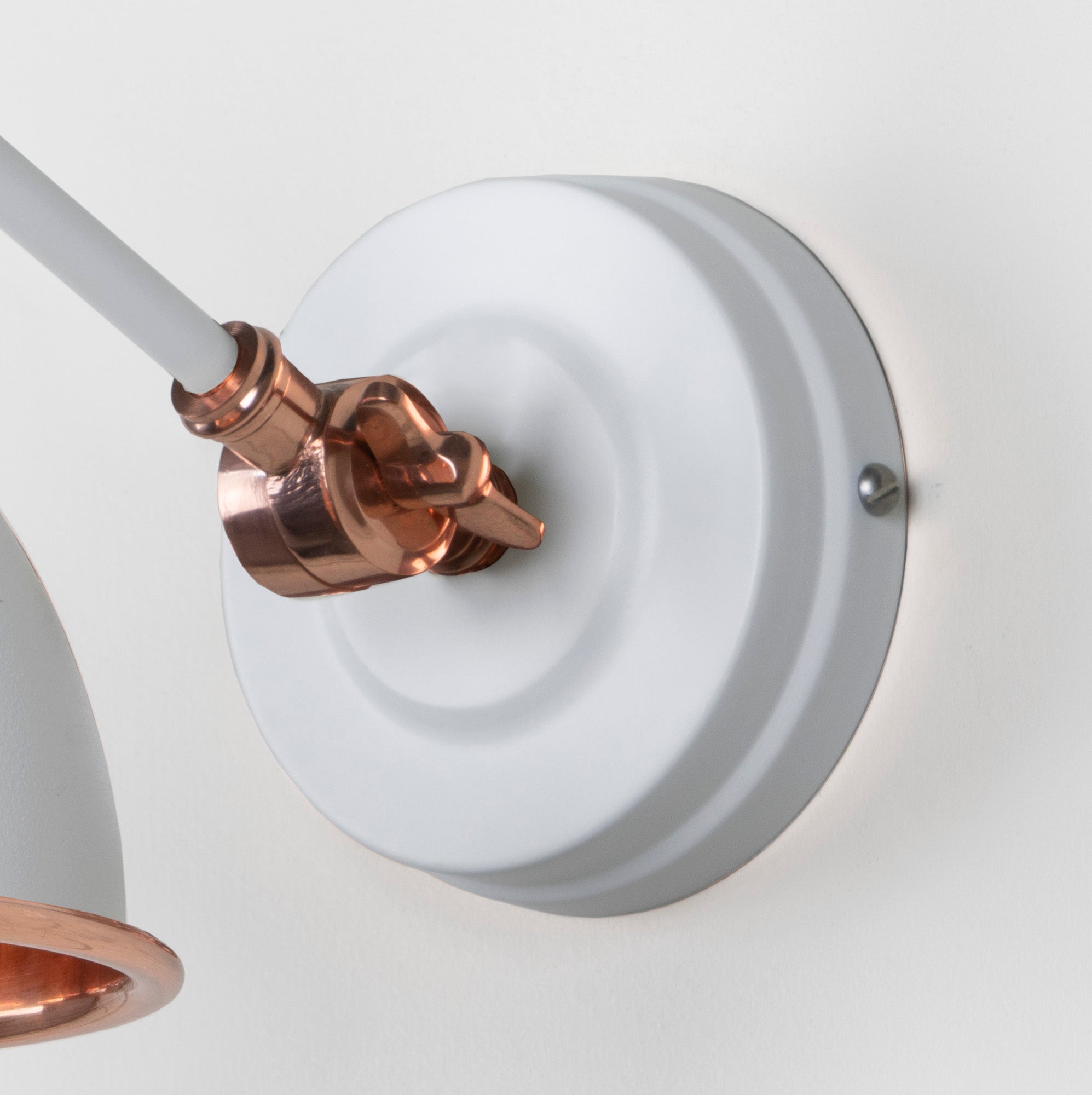 Hammered Copper Brindley Wall Light Flock, close up view of fitting and cable.