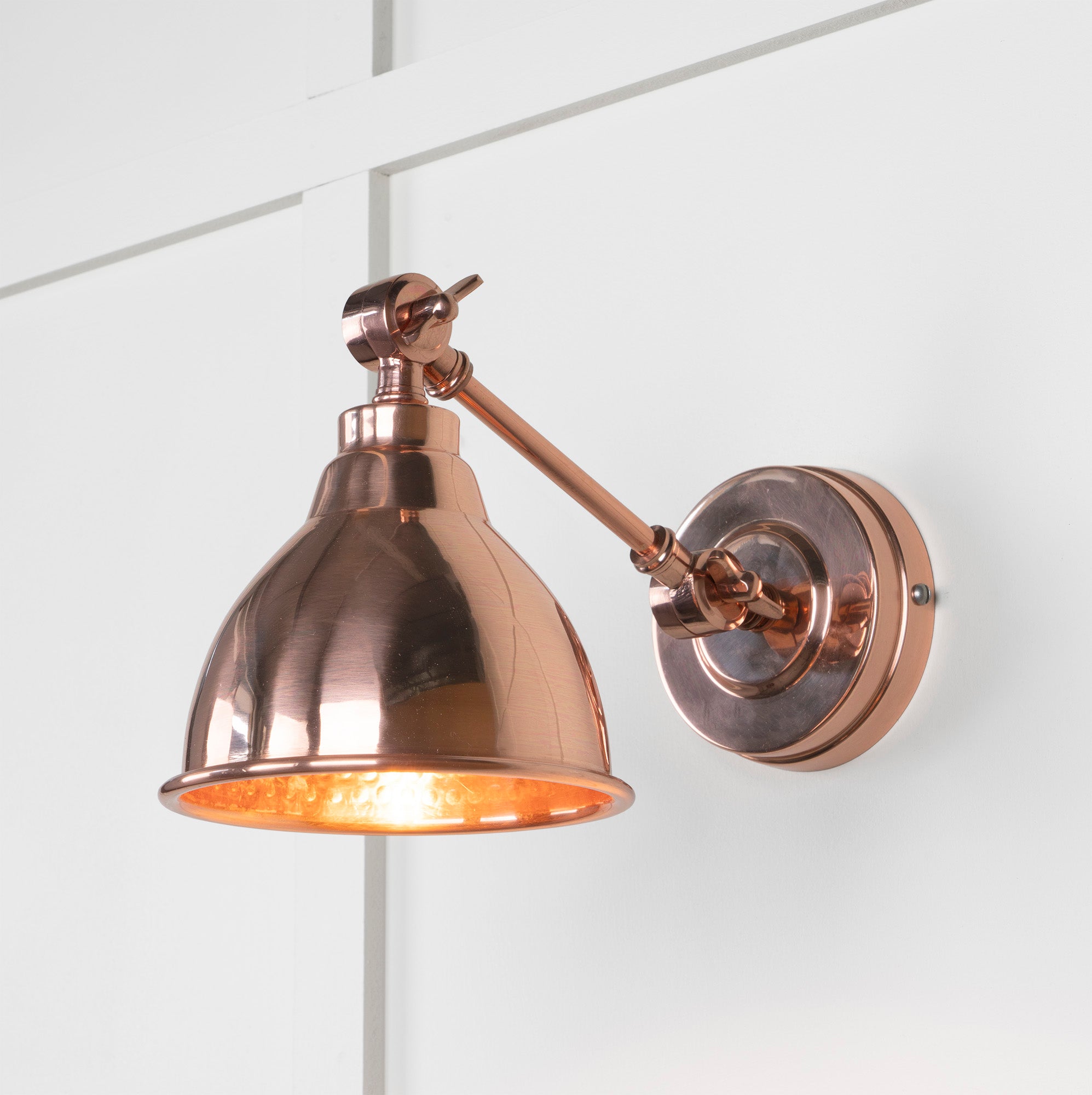 Hammered Copper Brindley Wall Light , Front Side with light on.