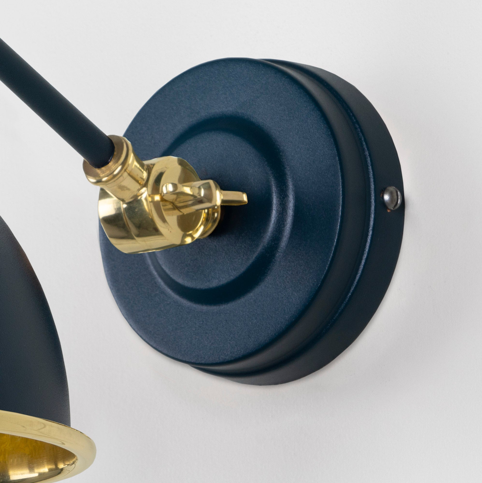 Hammered Brass Brindley Wall Light Dusk, close up view of fitting and cable.