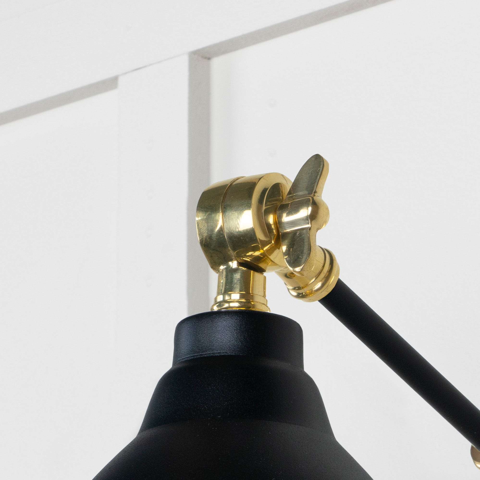Hammered Brass Brindley Wall Light Elan Black, Detailed close up view of pendant.