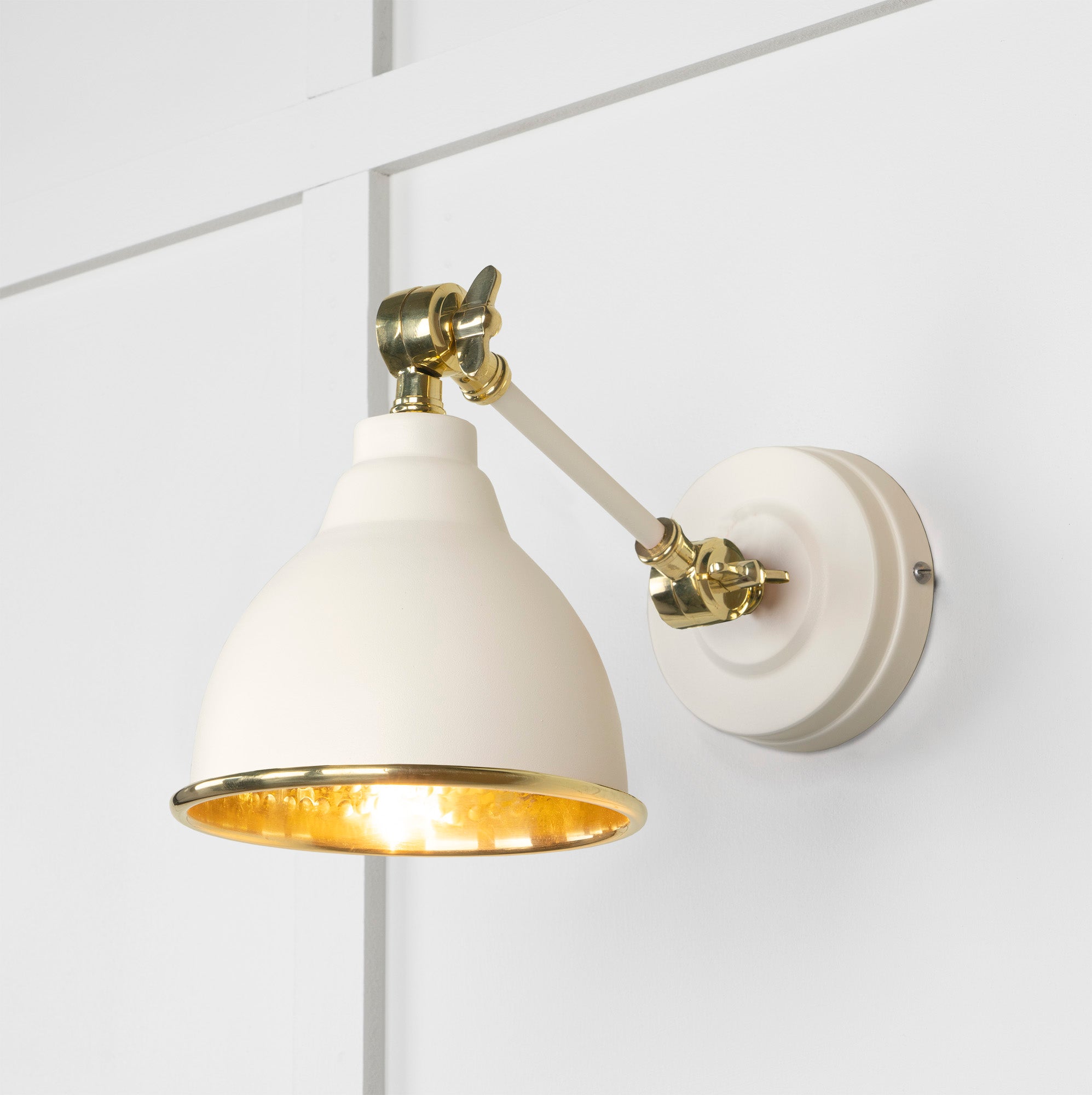 Hammered Brass Brindley Wall Light Teasel, Front Side with light on.
