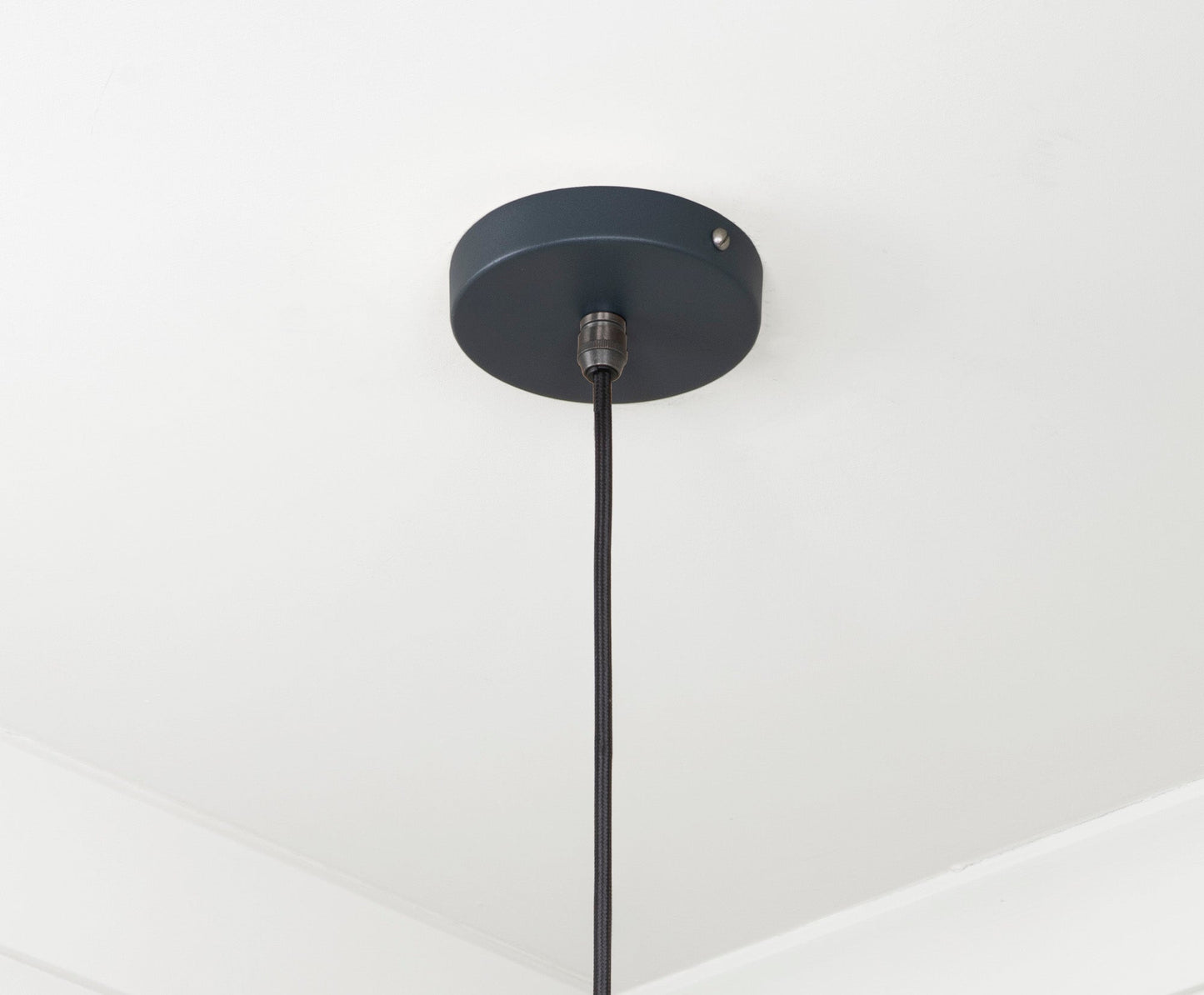 Smooth Brass Frankley Pendant Light Soot, close up view of fitting and cable.