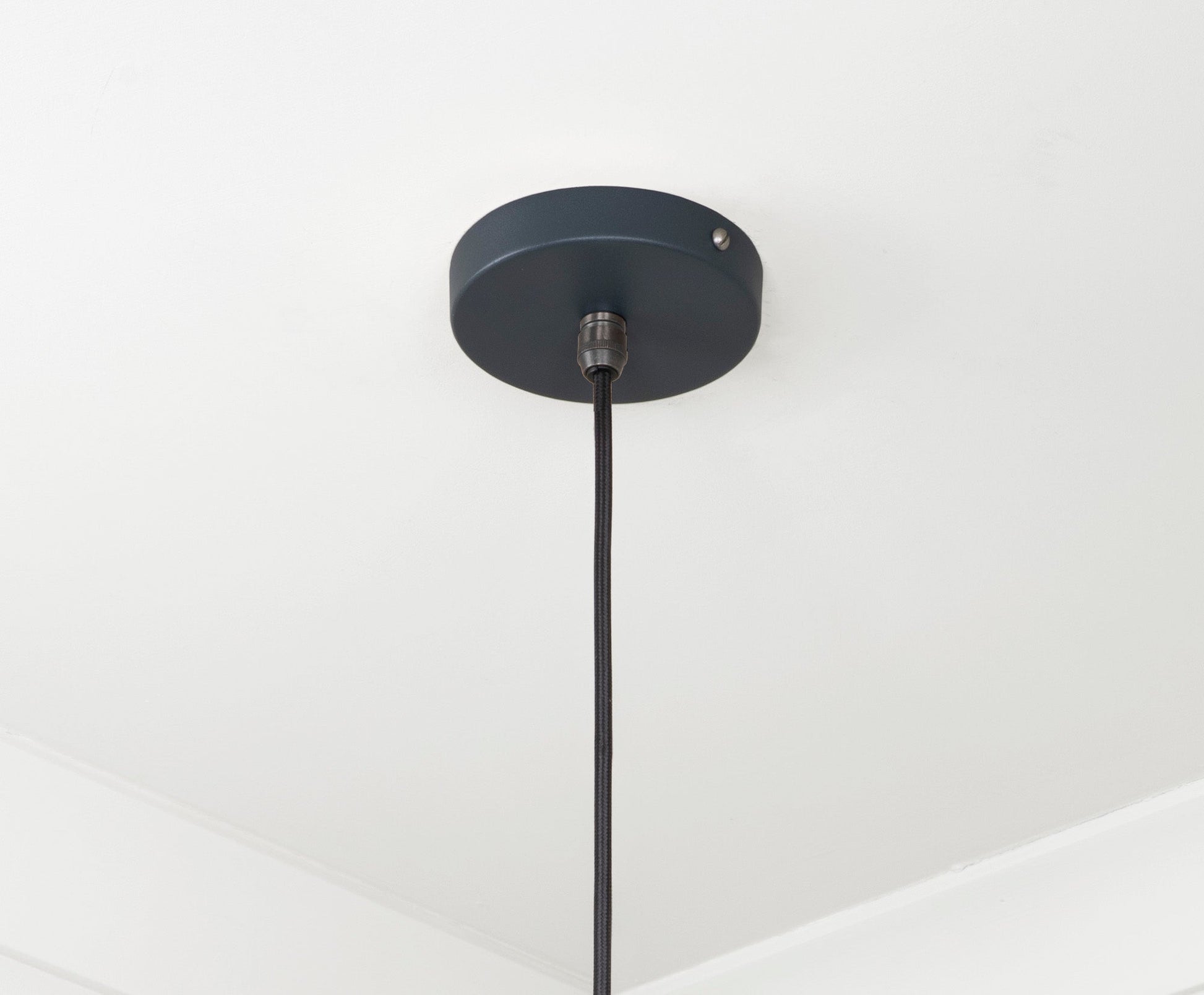 Smooth Brass Frankley Pendant Light Soot, close up view of fitting and cable.