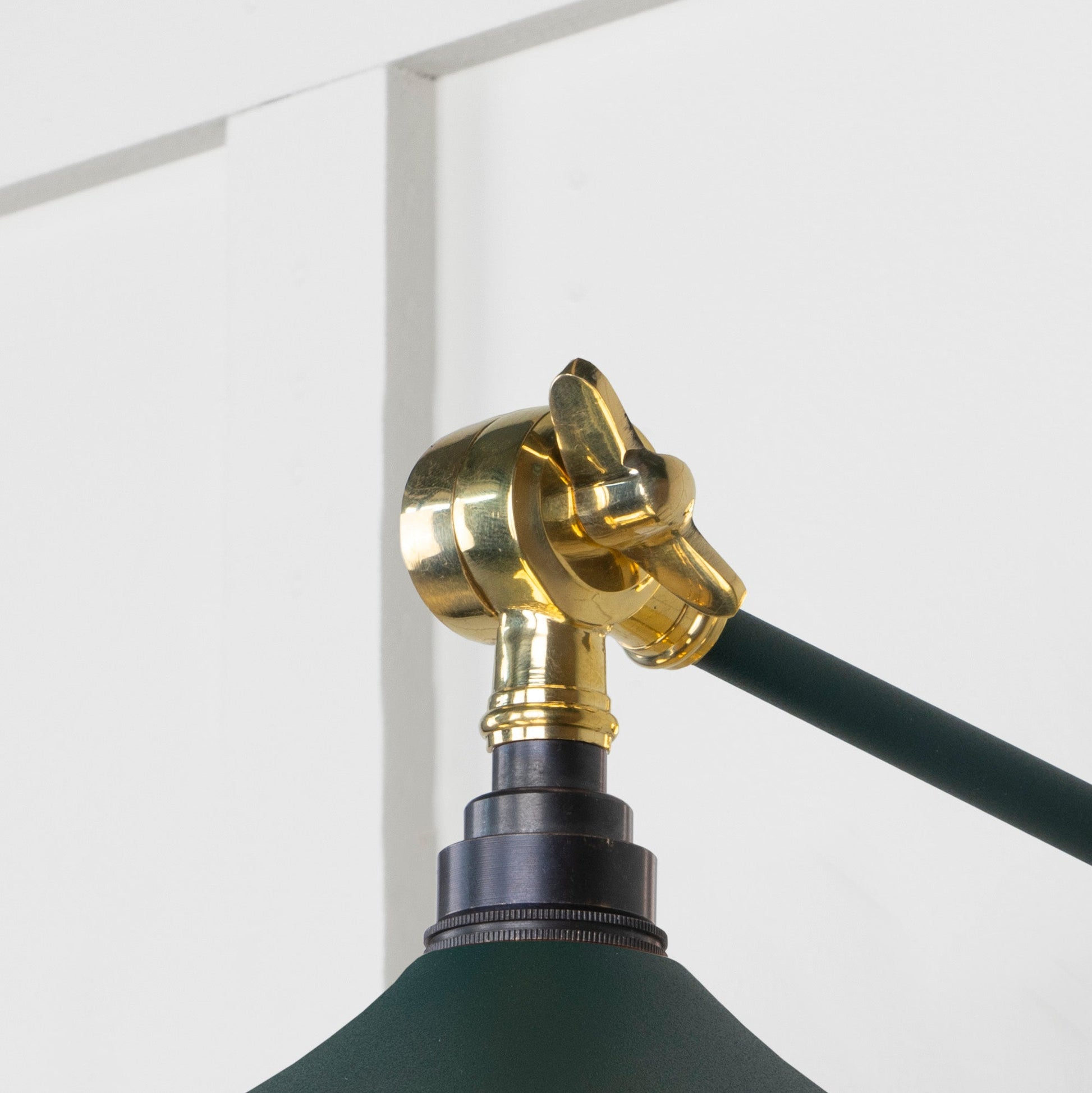 Smooth Brass Flora Wall Light Dingle, Detailed close up view of pendant.