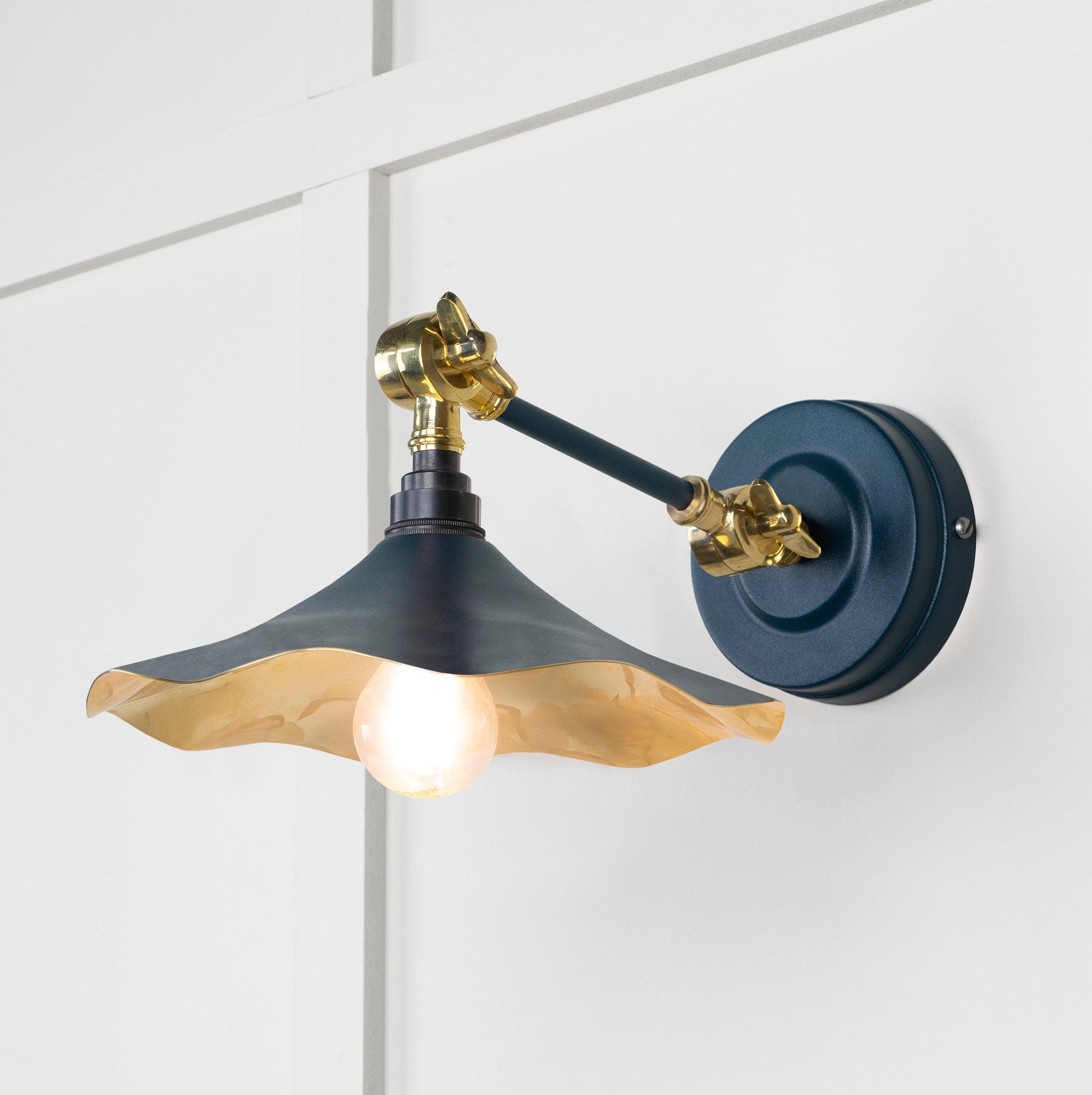 Smooth Brass Flora Wall Light Dusk, Front Side with light on.