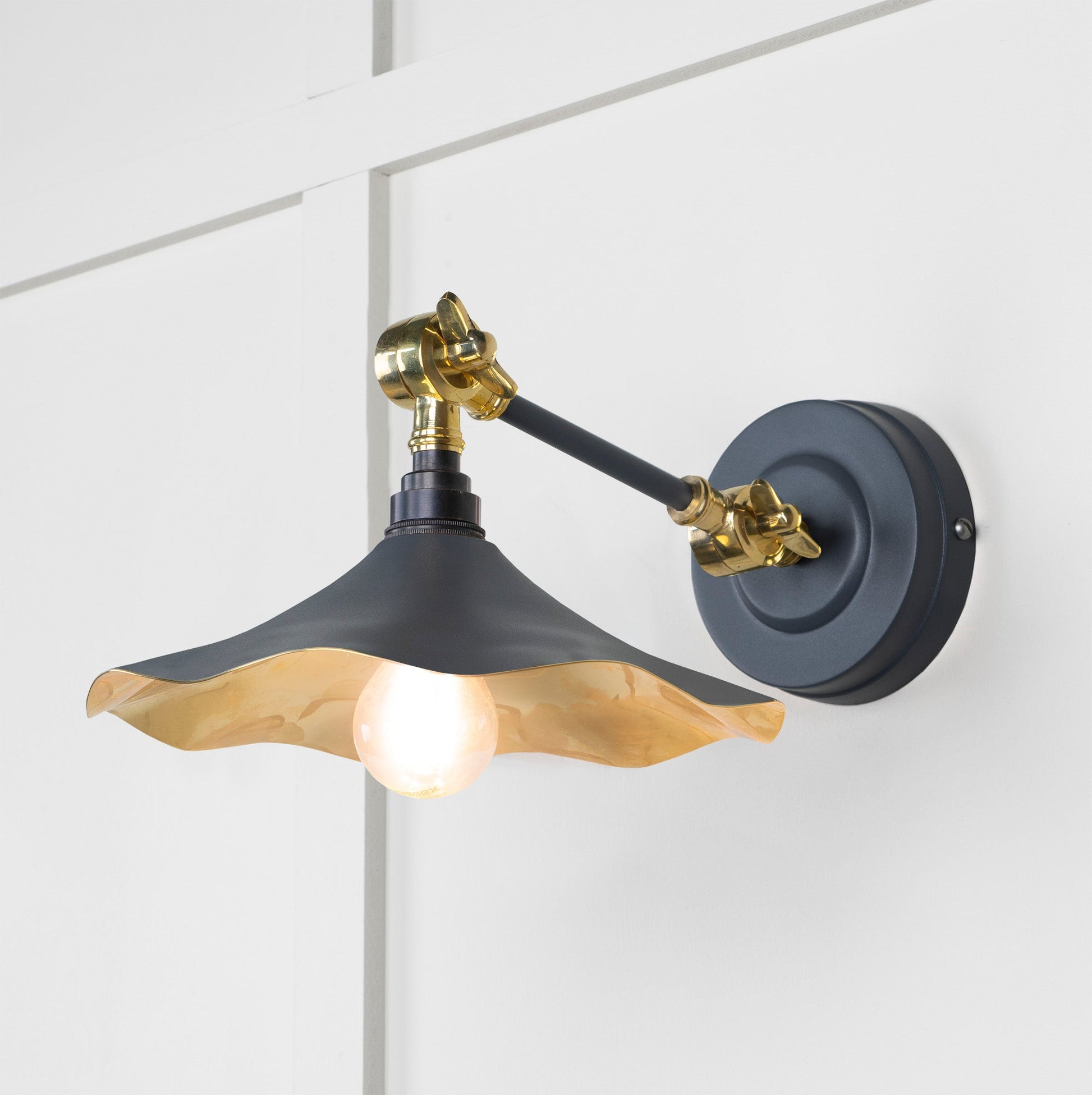 Smooth Brass Flora Wall Light Slate, Front Side with light on.