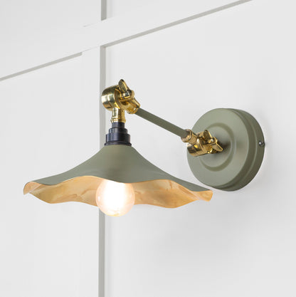 Smooth Brass Flora Wall Light Tump, Front Side with light on.