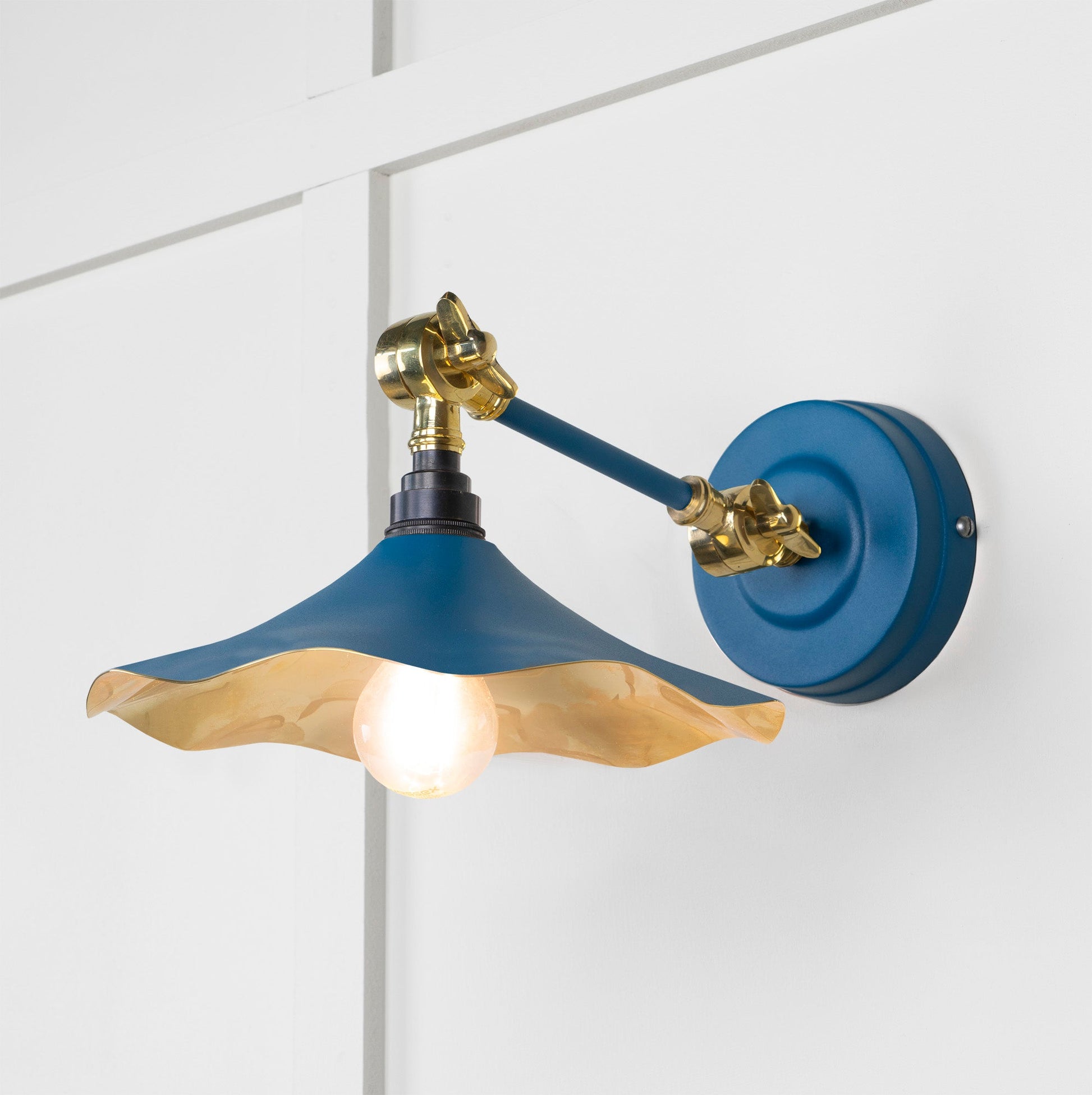 Smooth Brass Flora Wall Light Upstream, Front Side with light on.