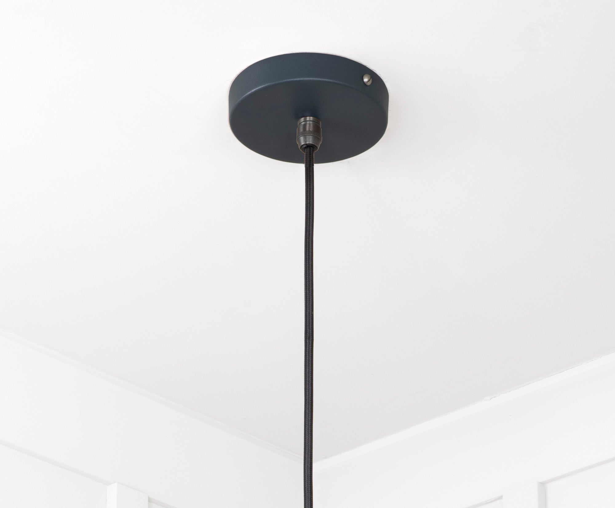 Smooth Brass Flora Pendant Light Soot, close up view of fitting and cable.