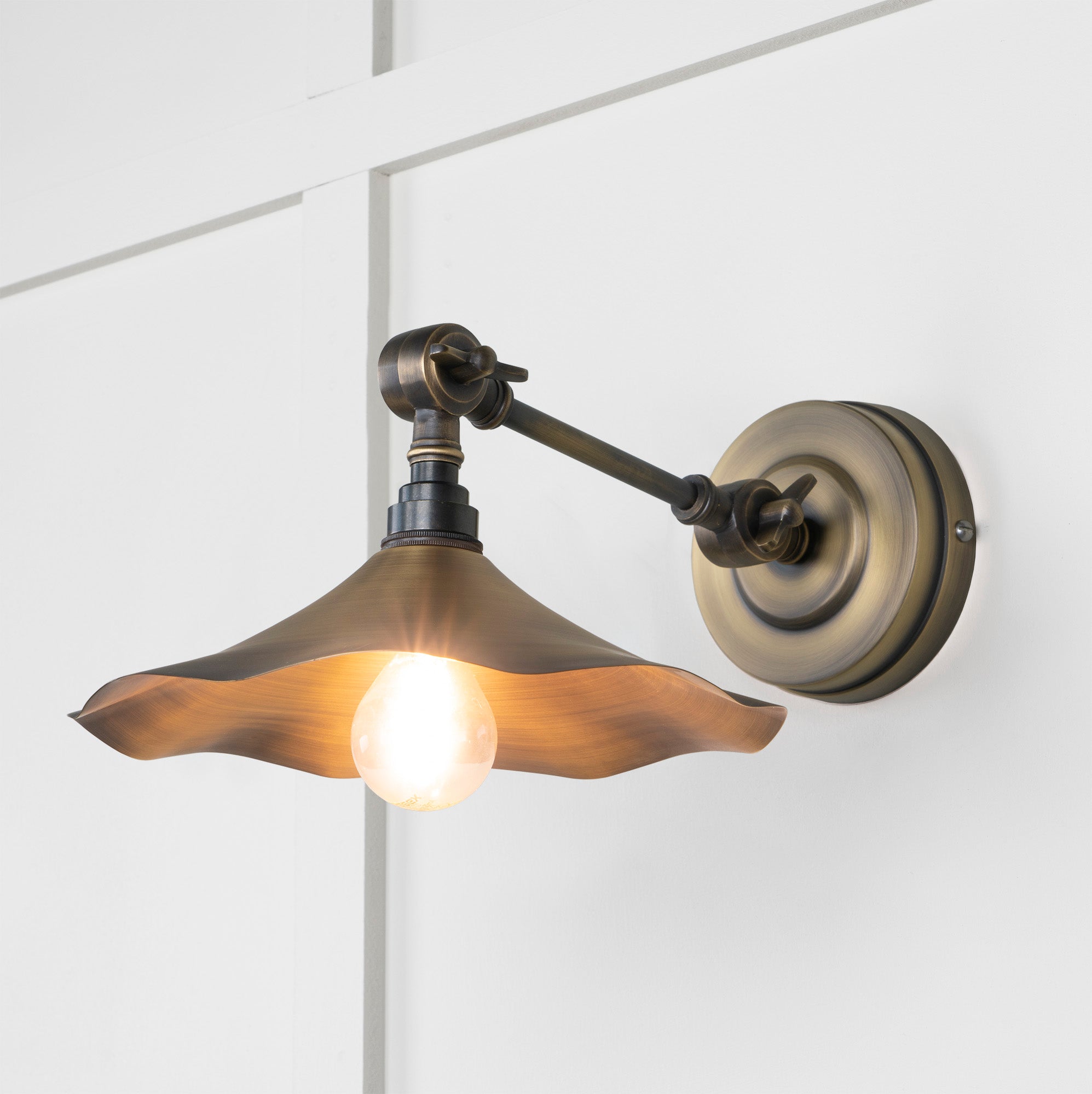 Aged Brass Flora Wall Light , Front Side with light on.