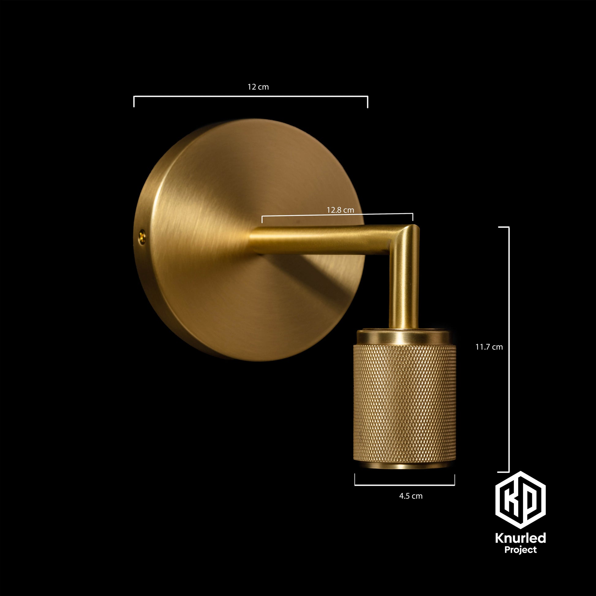 Brass wall light at an angle with product measurements on a black background