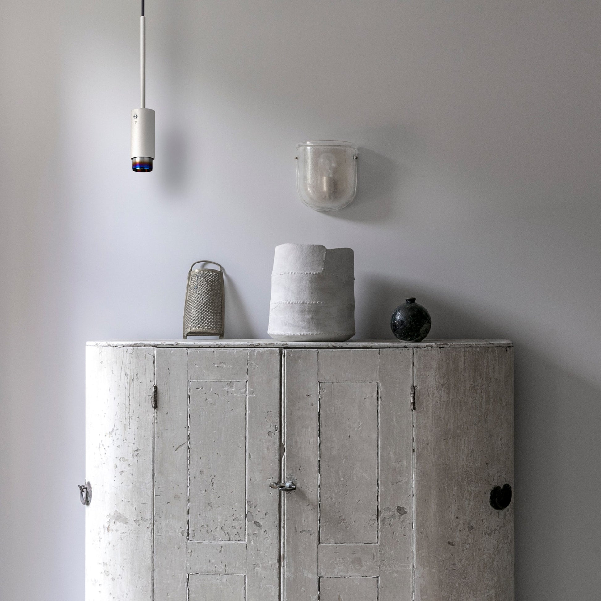 Exhaust Pendant Light / Linear / Stone Burnt Steel, pendants hanging from ceiling in setting with background.