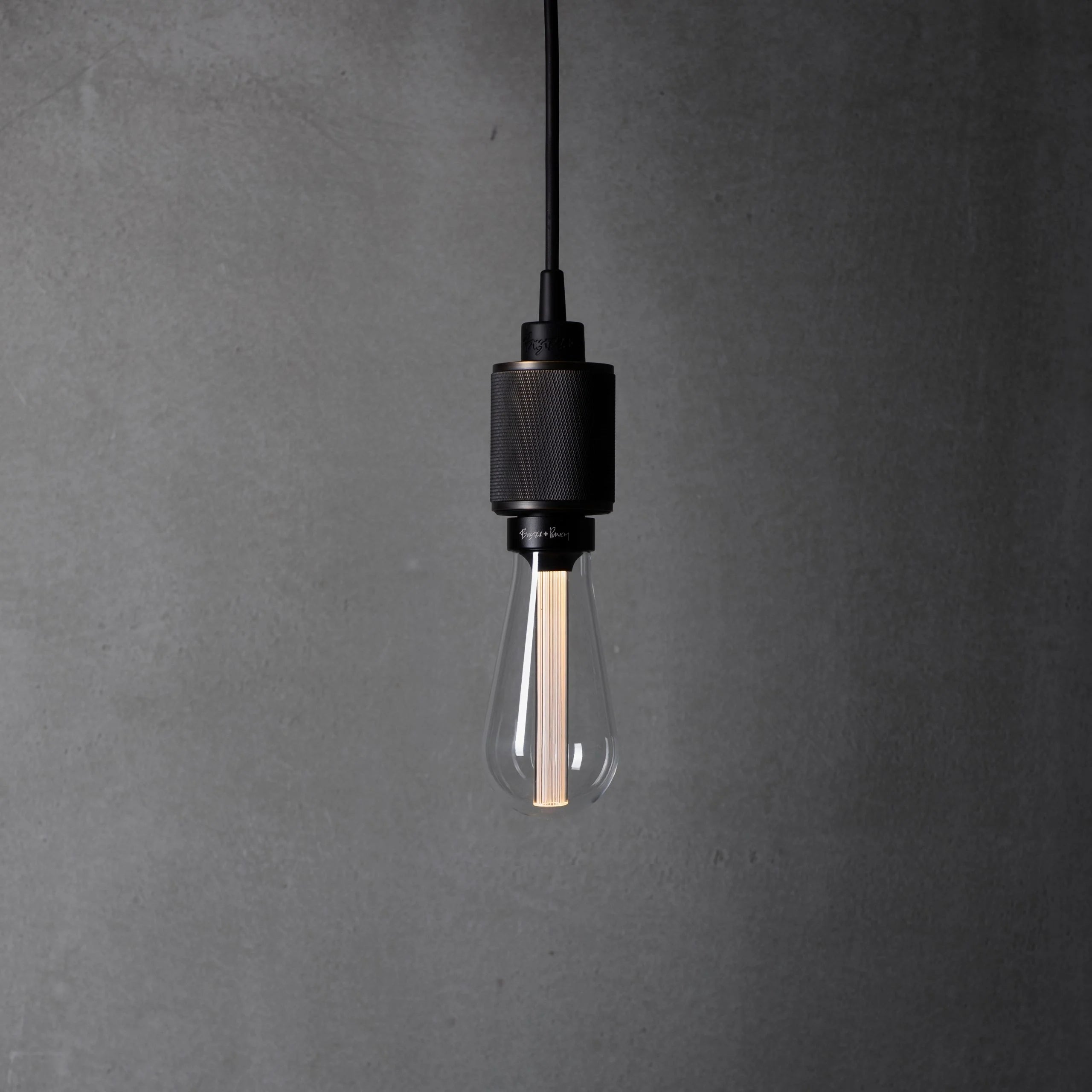 Heavy Metal Pendant light / Cross smoked bronze, front view.