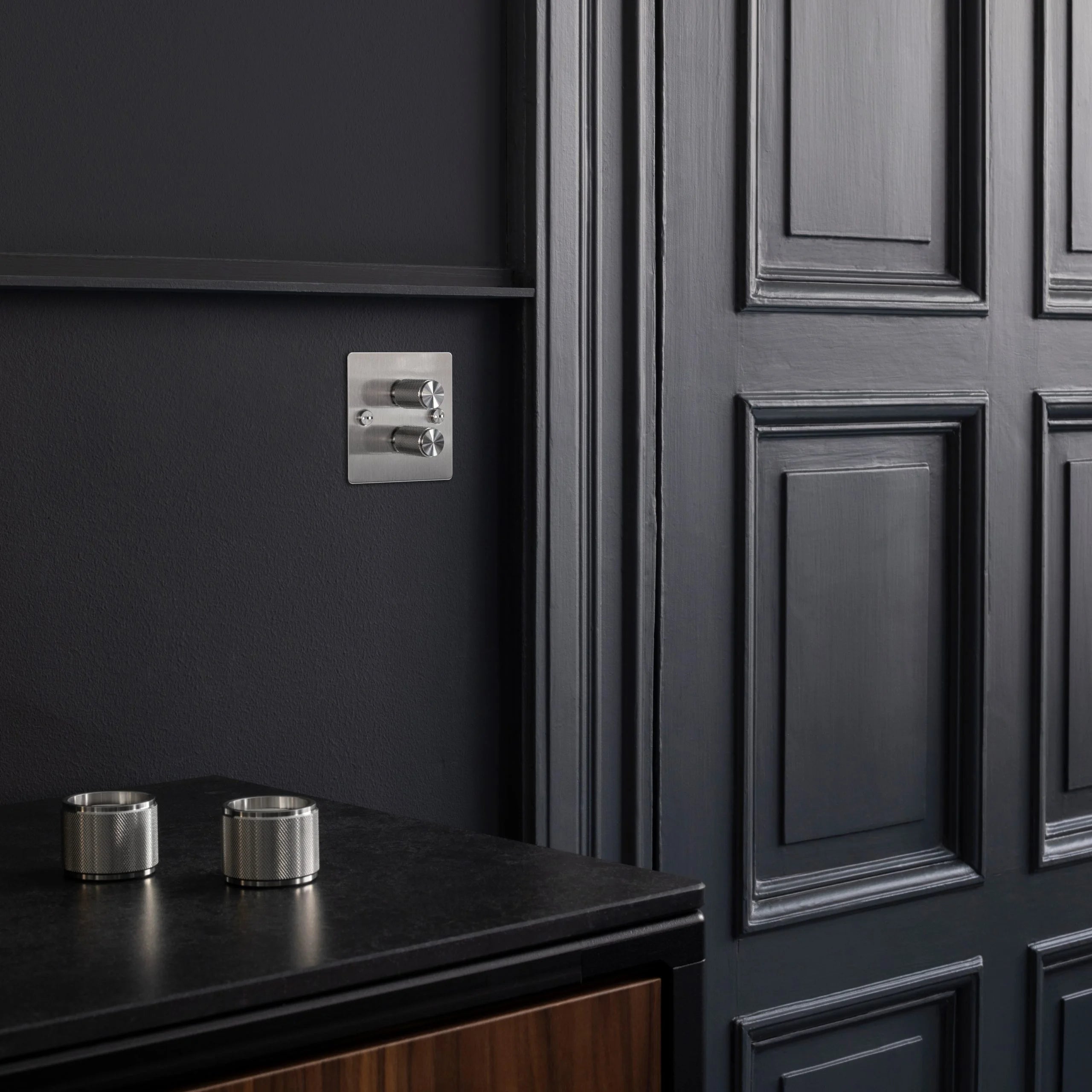 2G Dimmer/ 120W/ Steel with steel details, on wall in setting.