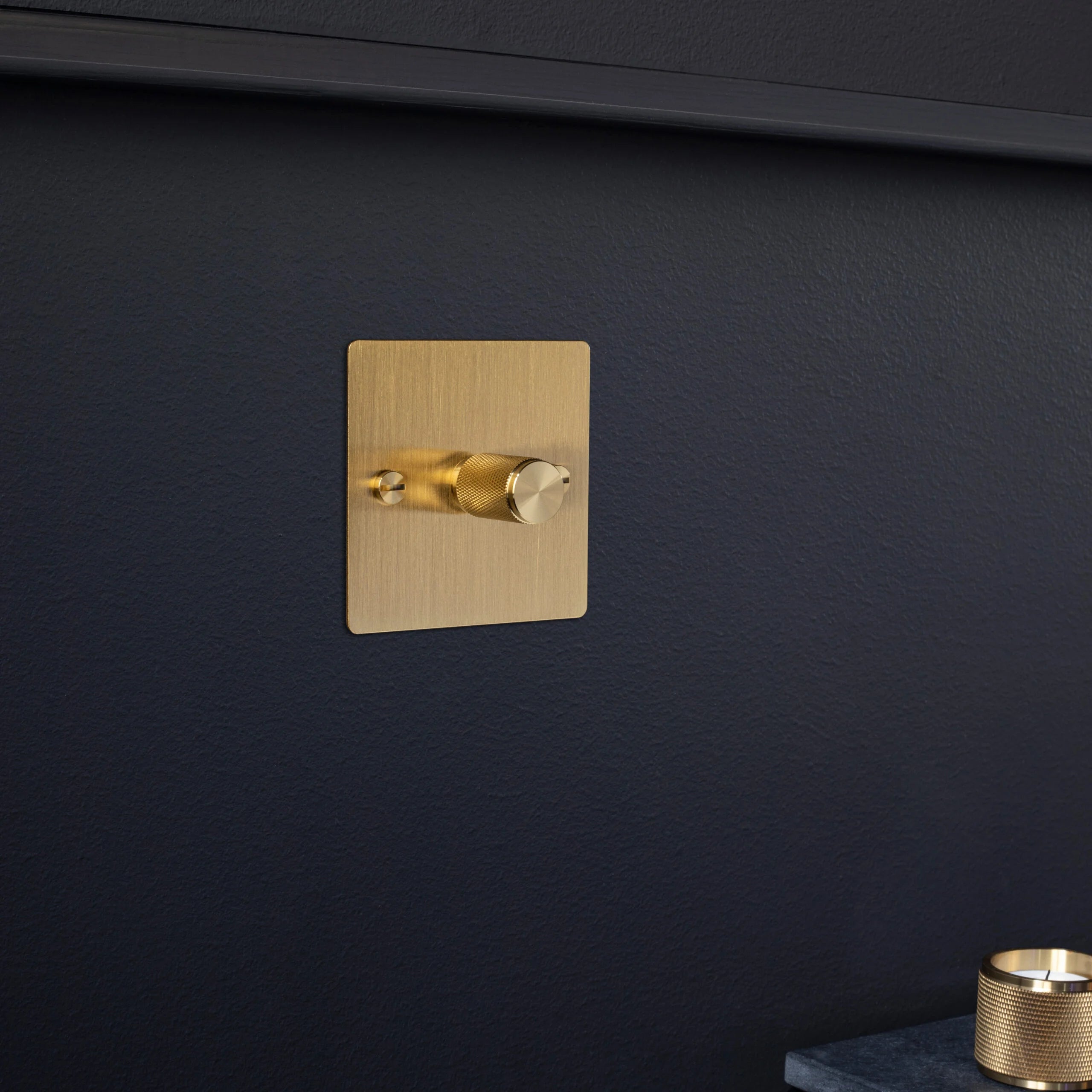 1G Dimmer/ 100W/ Brass with brass details, in setting.