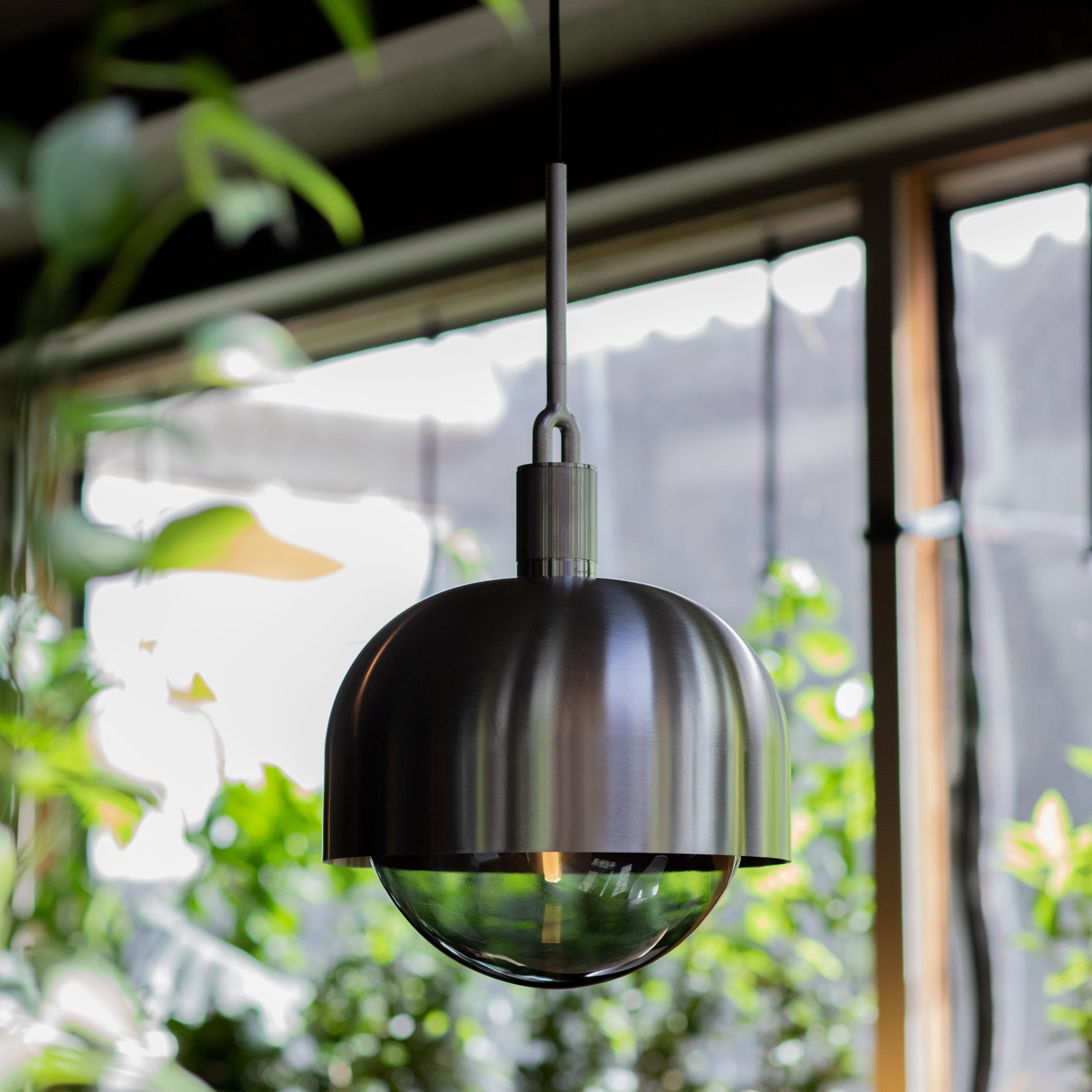 Forked Pendant Light / Shade / Globe / Smoked / Large Steel, detailed close up view of pendant light in setting.