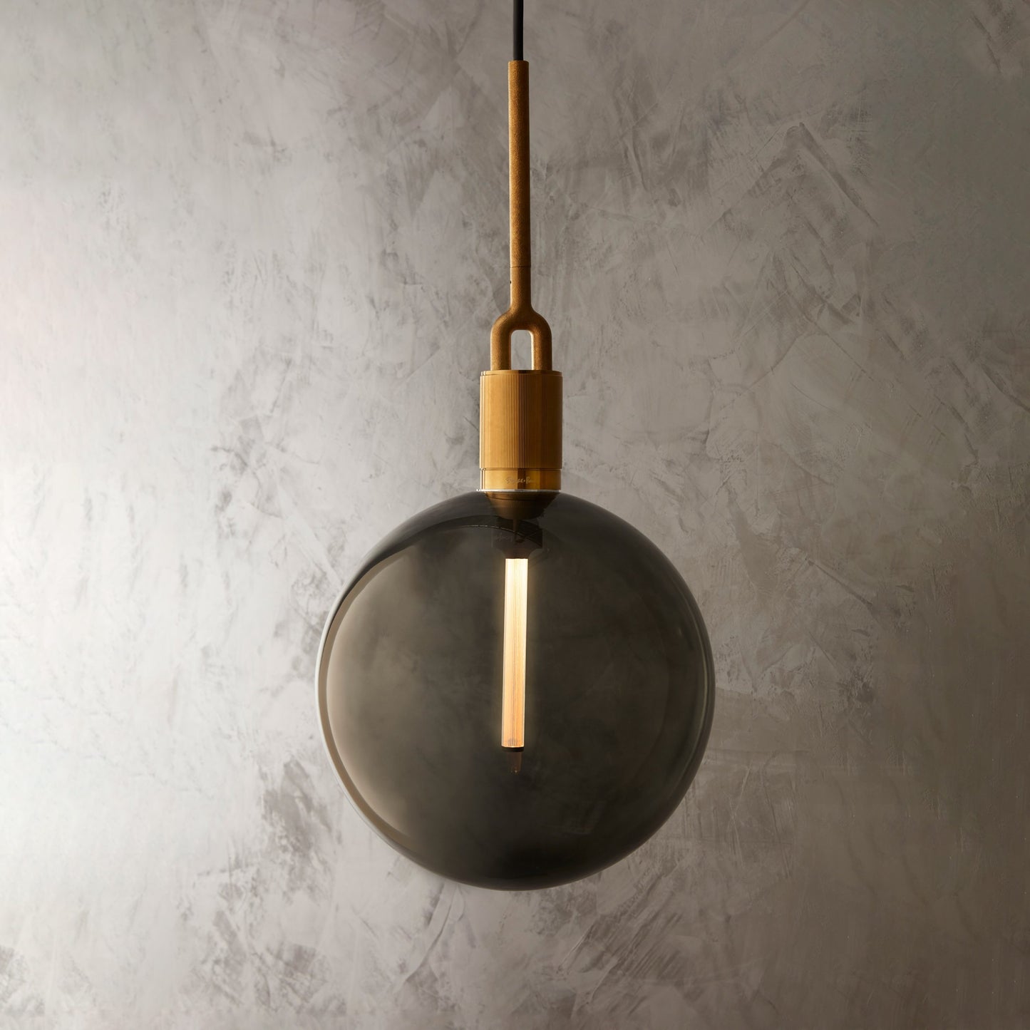 Forked Pendant Light / Globe / Smoked / Large Brass, close up view with background.