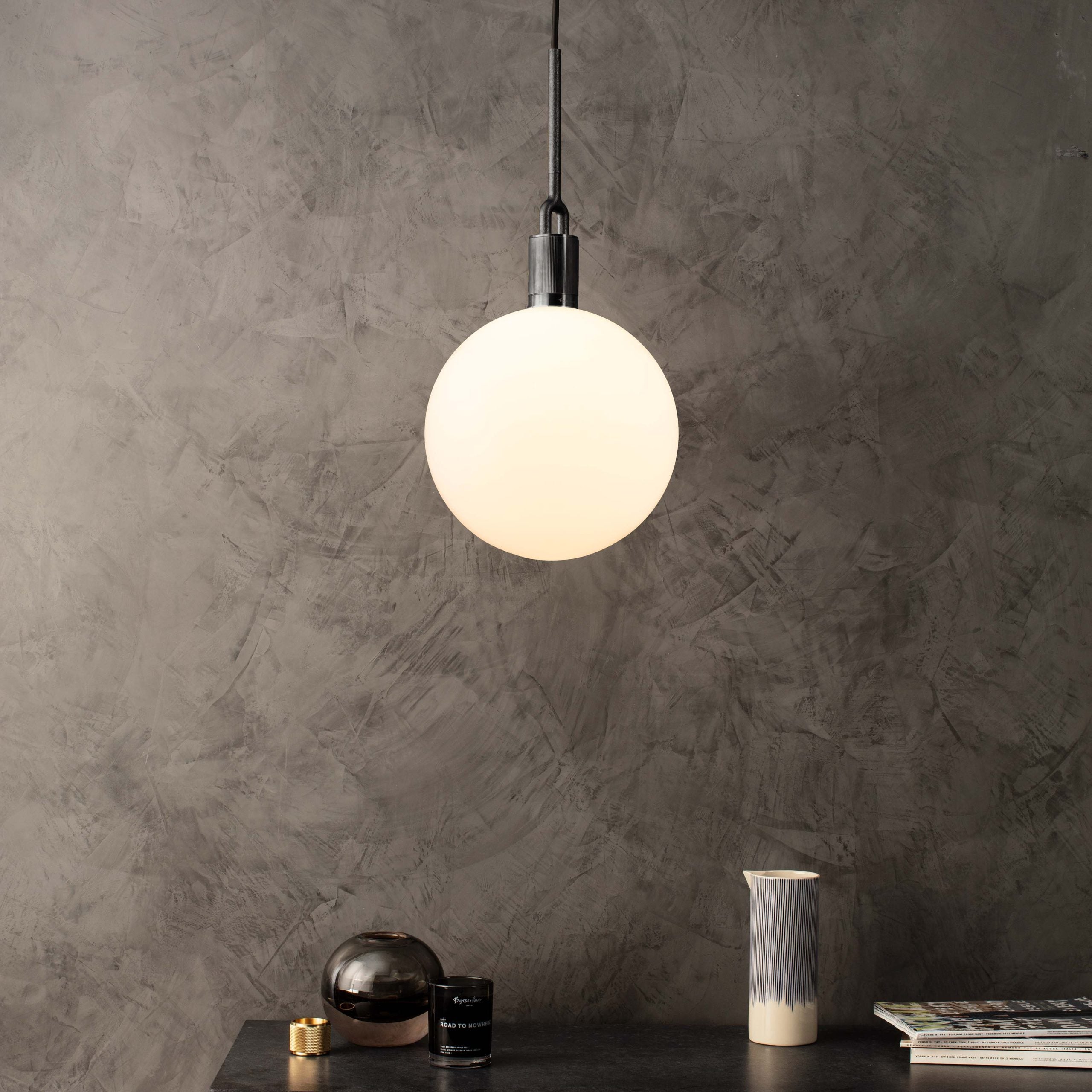 Forked Pendant Light / Globe / Opal / large gun metal, front view in setting.