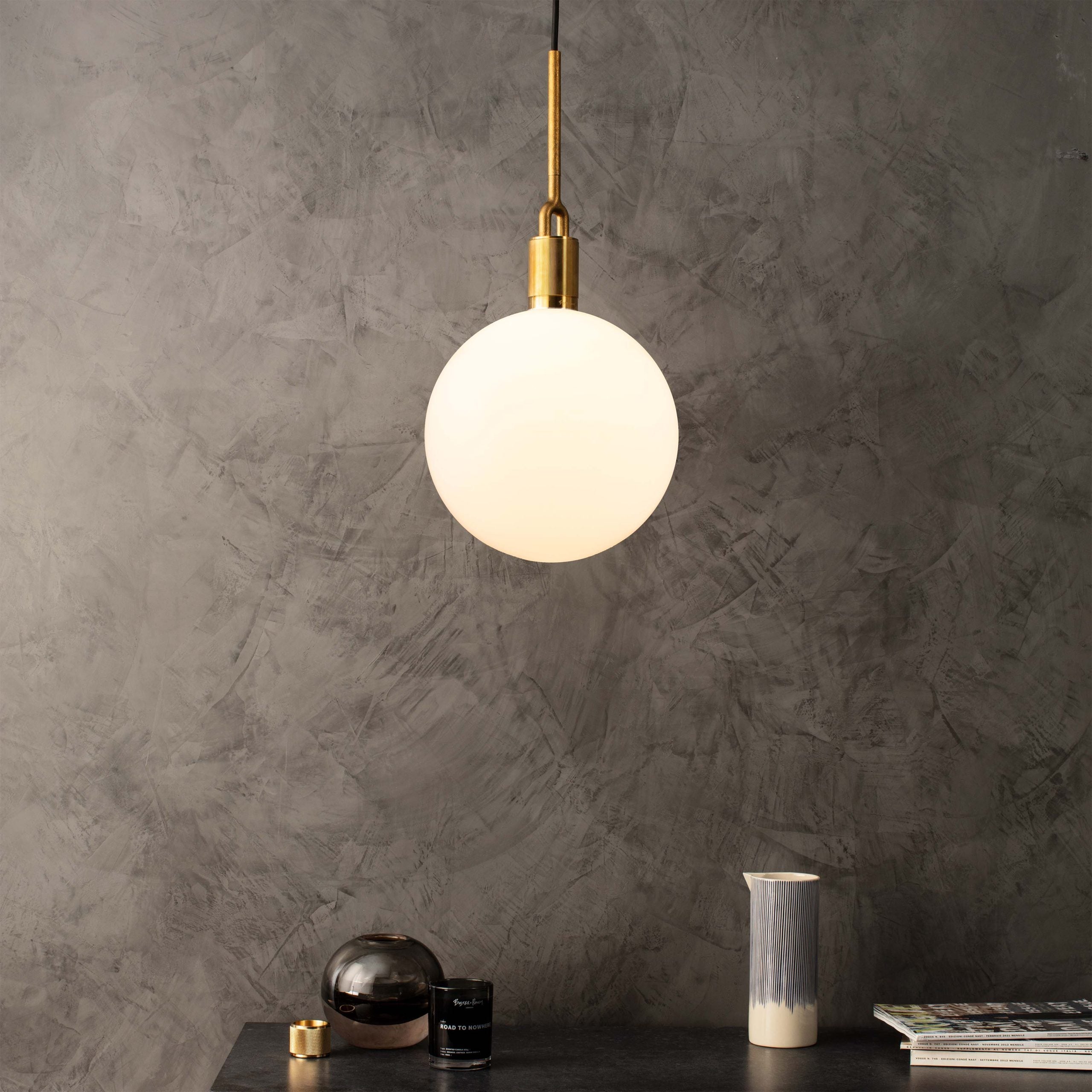 Forked Pendant Light / Globe / Opal / large brass, front view in setting.