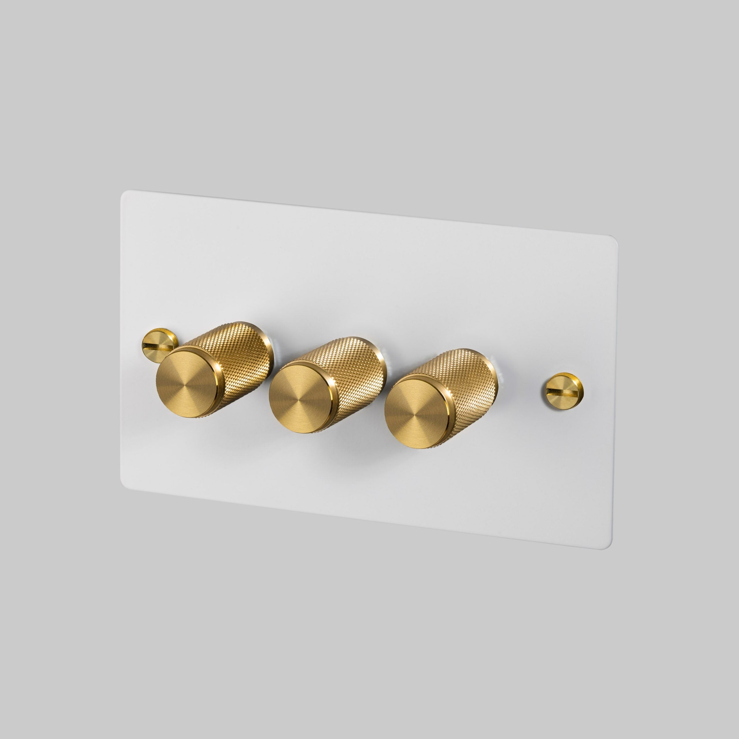 3G Dimmer/ 100W/ White with brass details, angled view.