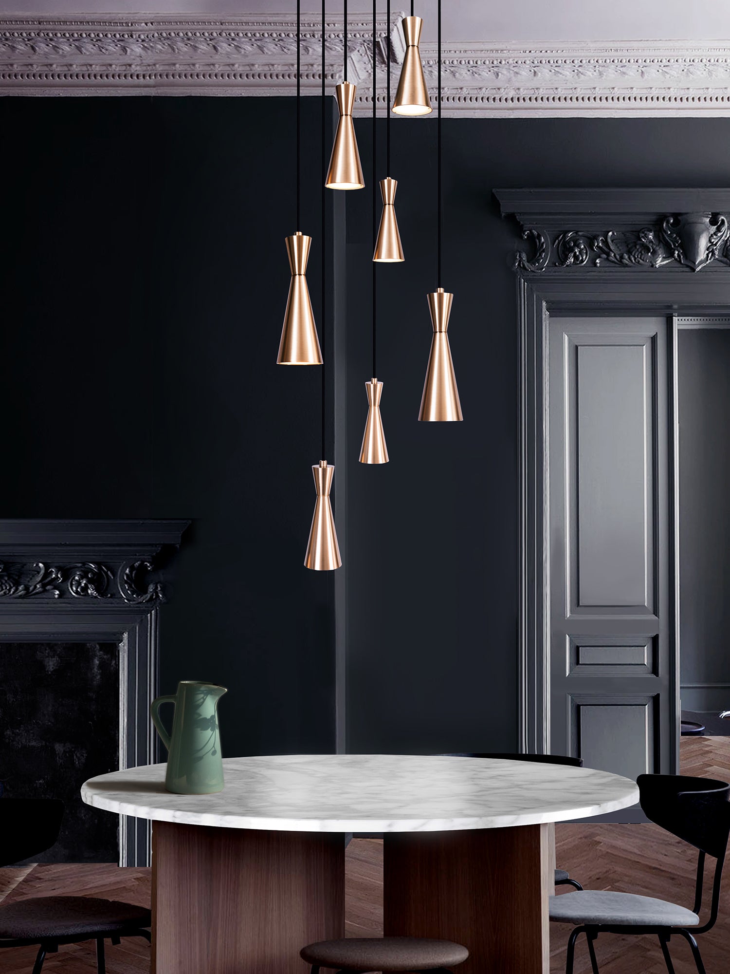 Cone 7 Cluster Light, hanging from ceiliing above table in setting.