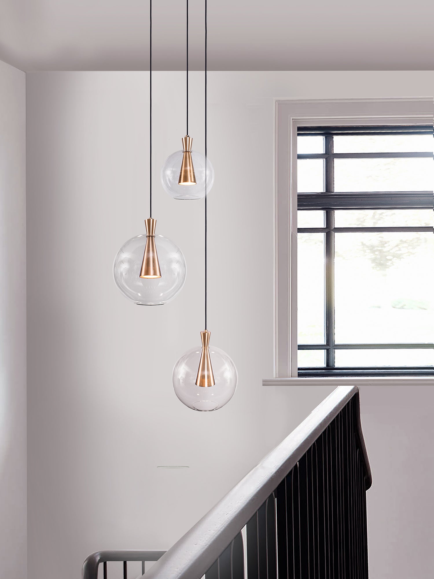 Cone 3 Shade Cluster Light, hanging in stair setting.