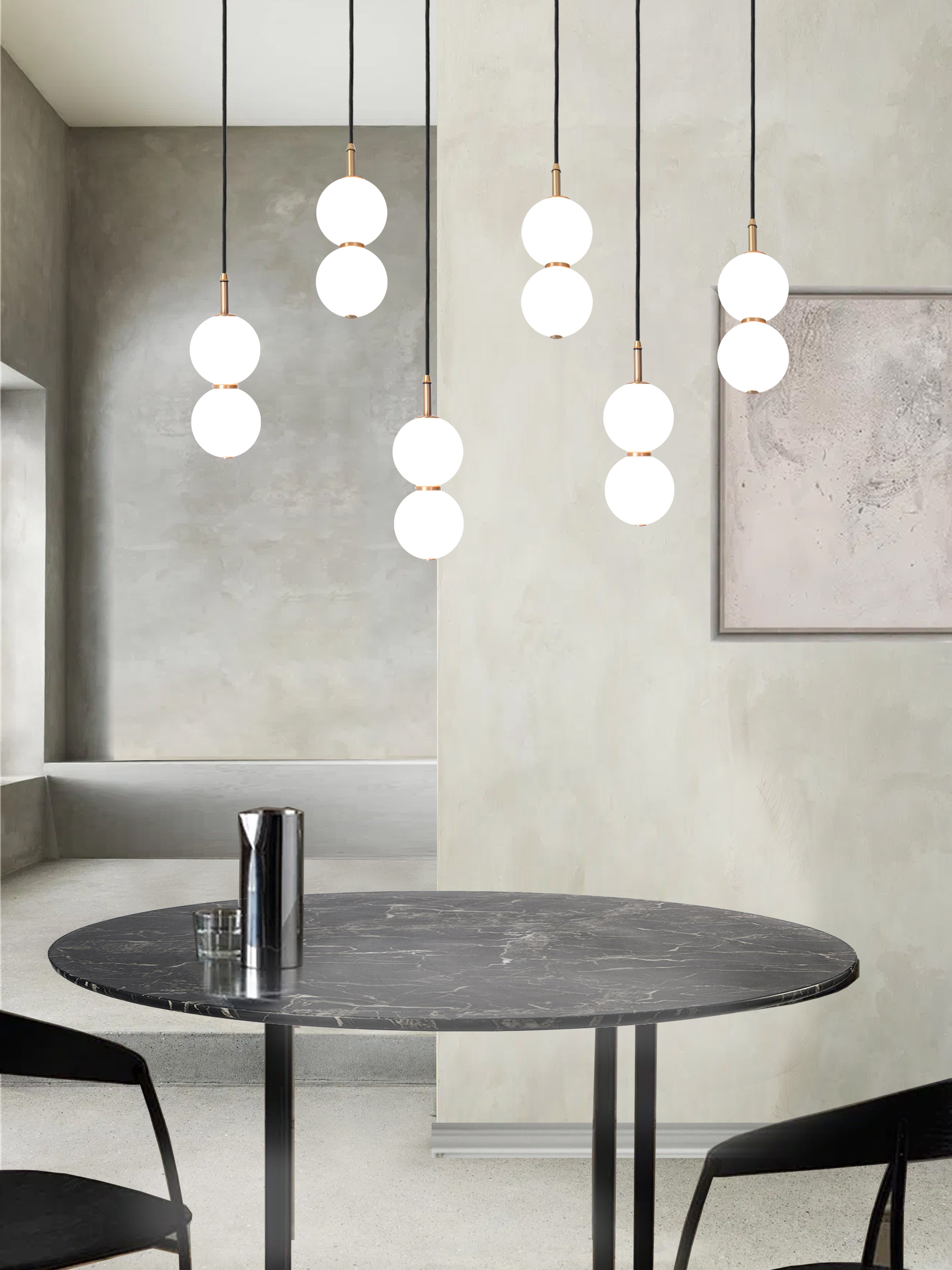 Echo Wide Cluster Light, hanging from ceiling above dining table in setting.