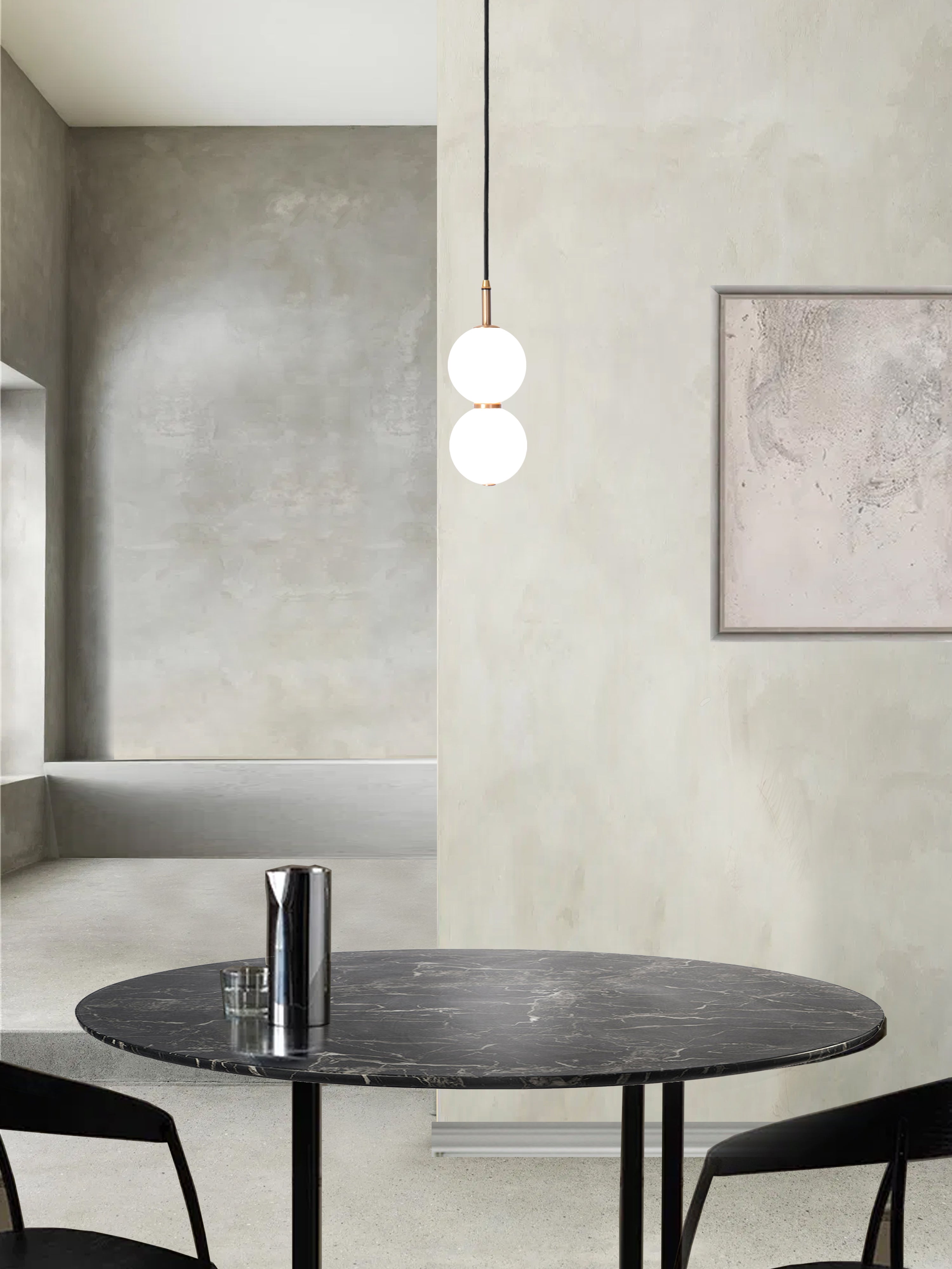 Echo Pendant Light. hanging from ceiling above table.