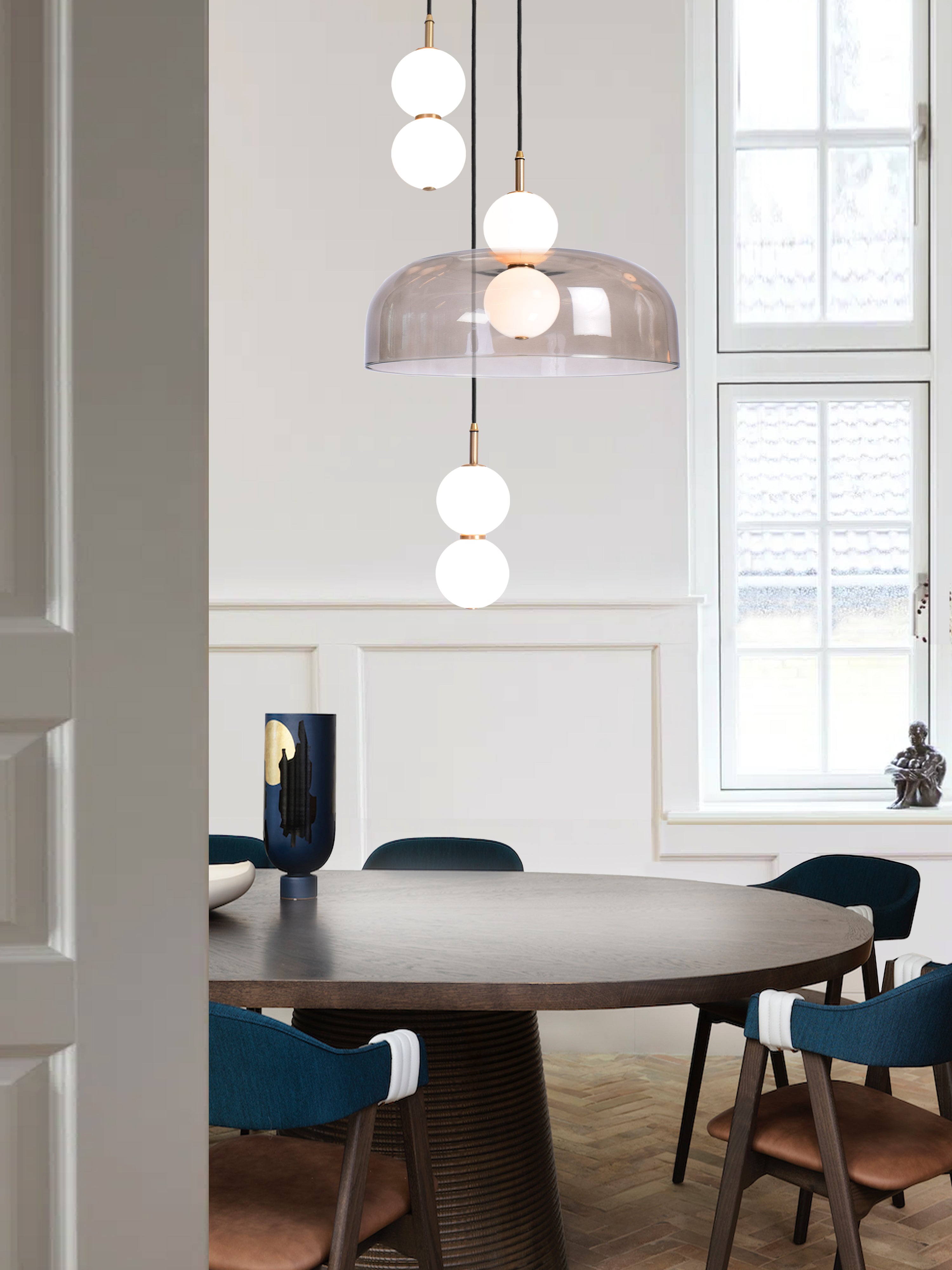 Echo 3 Shade Cluster Light, hanging from ceiling above table in setting.