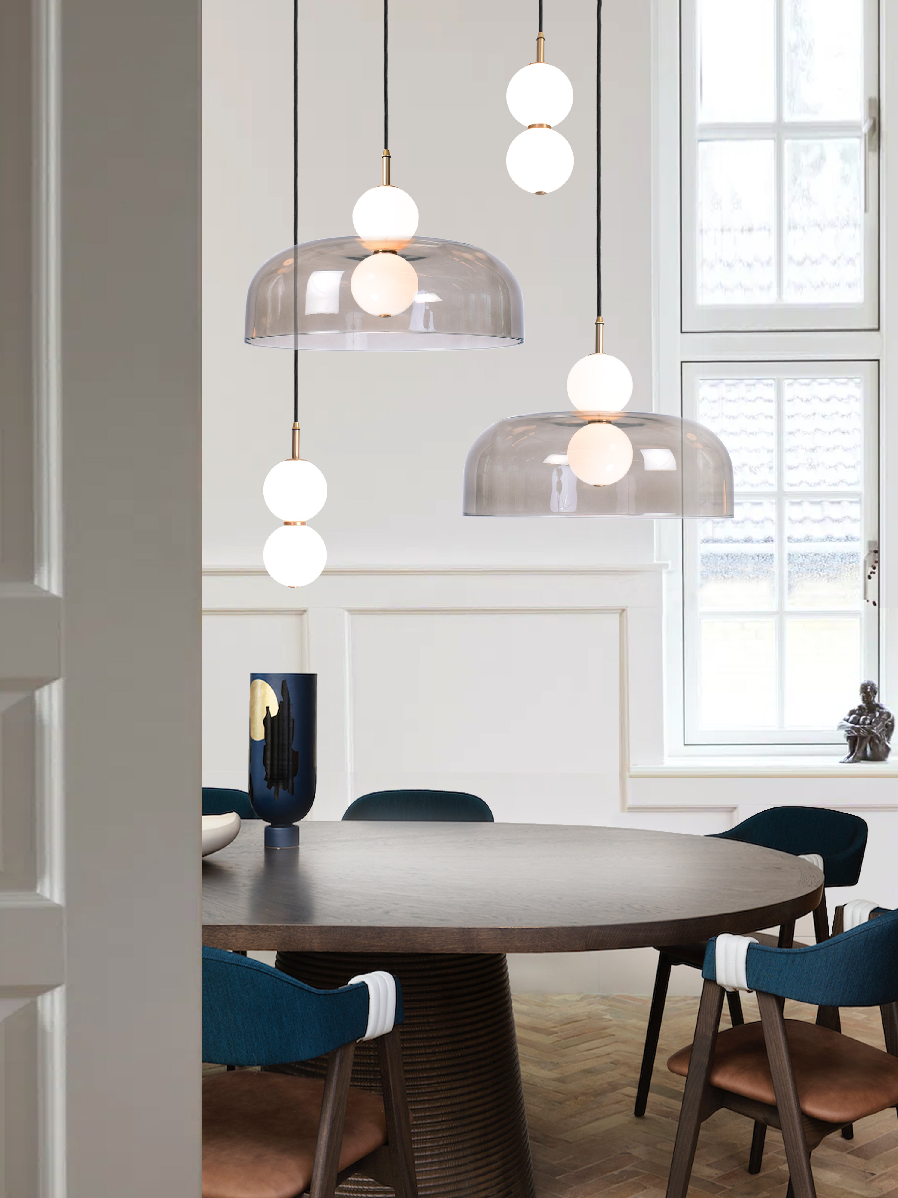 Echo 4 Shade Cluster Light, hanging from ceiling above table in setting.