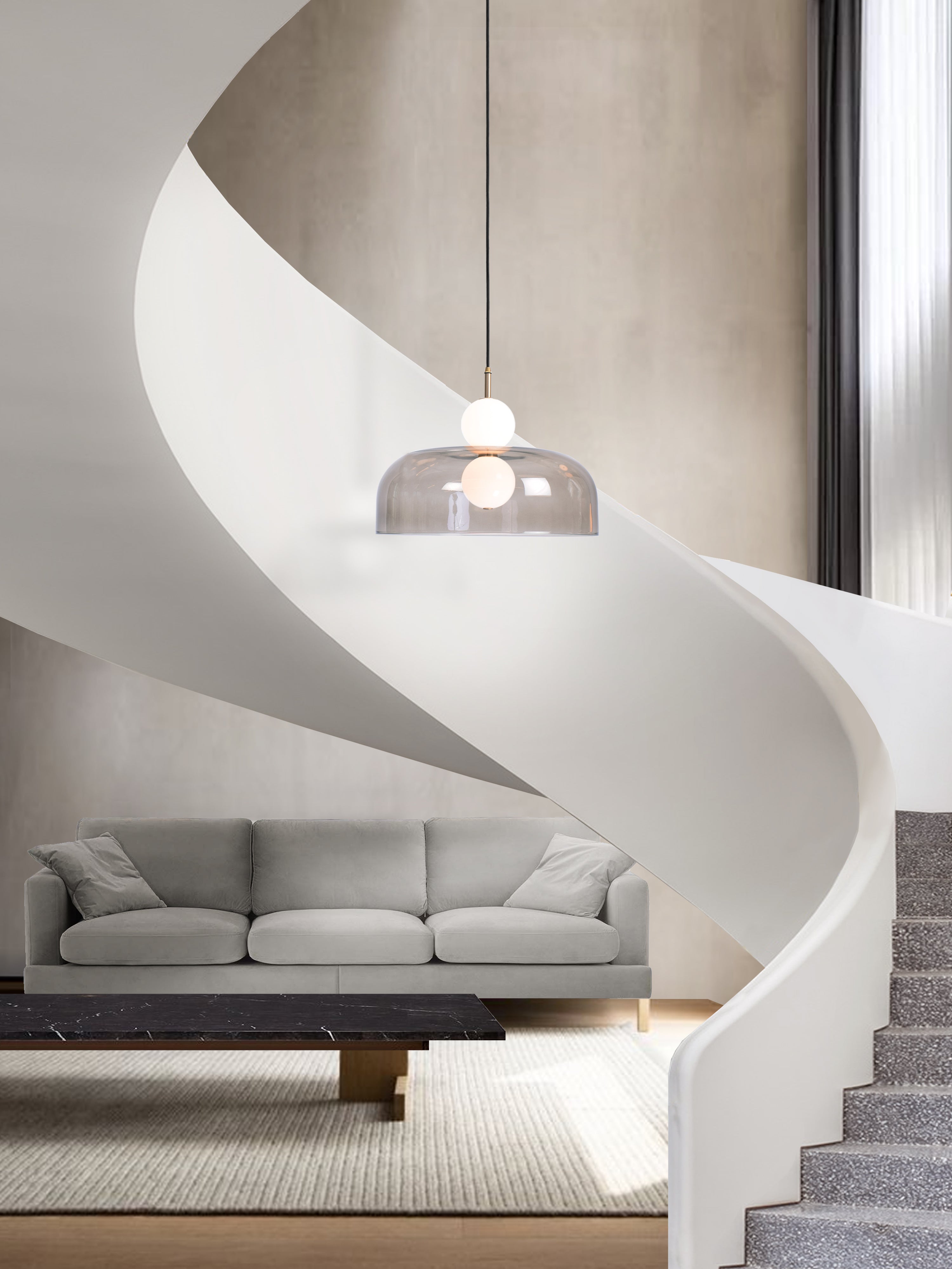 Echo Shade Pendant Light, hanging from ceiling above table in setting.
