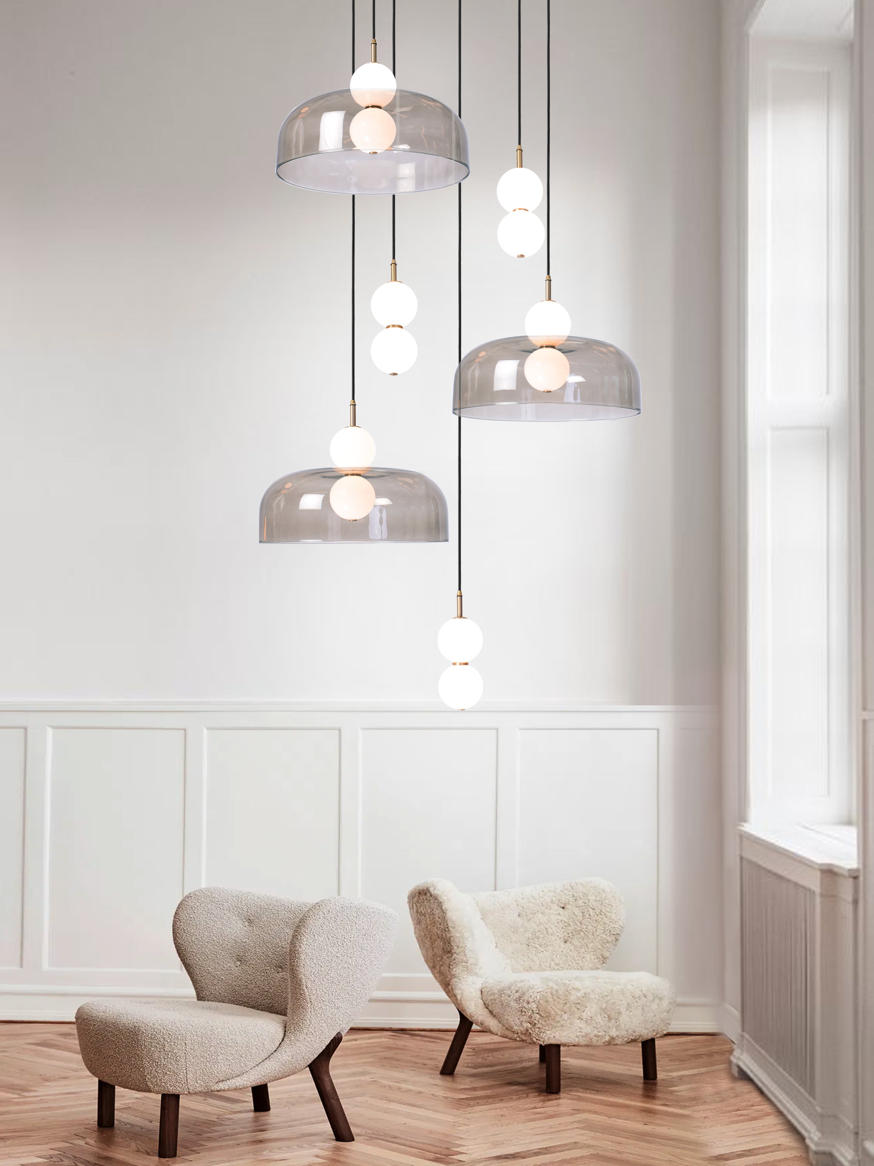 Echo 6 Shade Cluster Light, hanging from ceiling above chairs in setting.