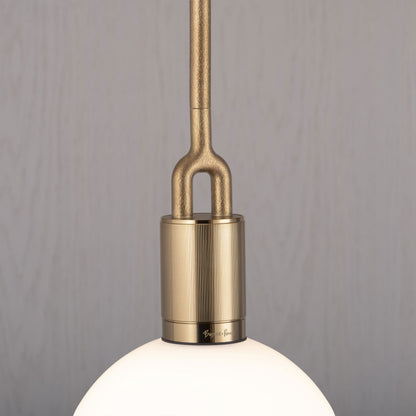 Forked pendant Light / Globe / Opal / Medium brass, detailed close up of fork.