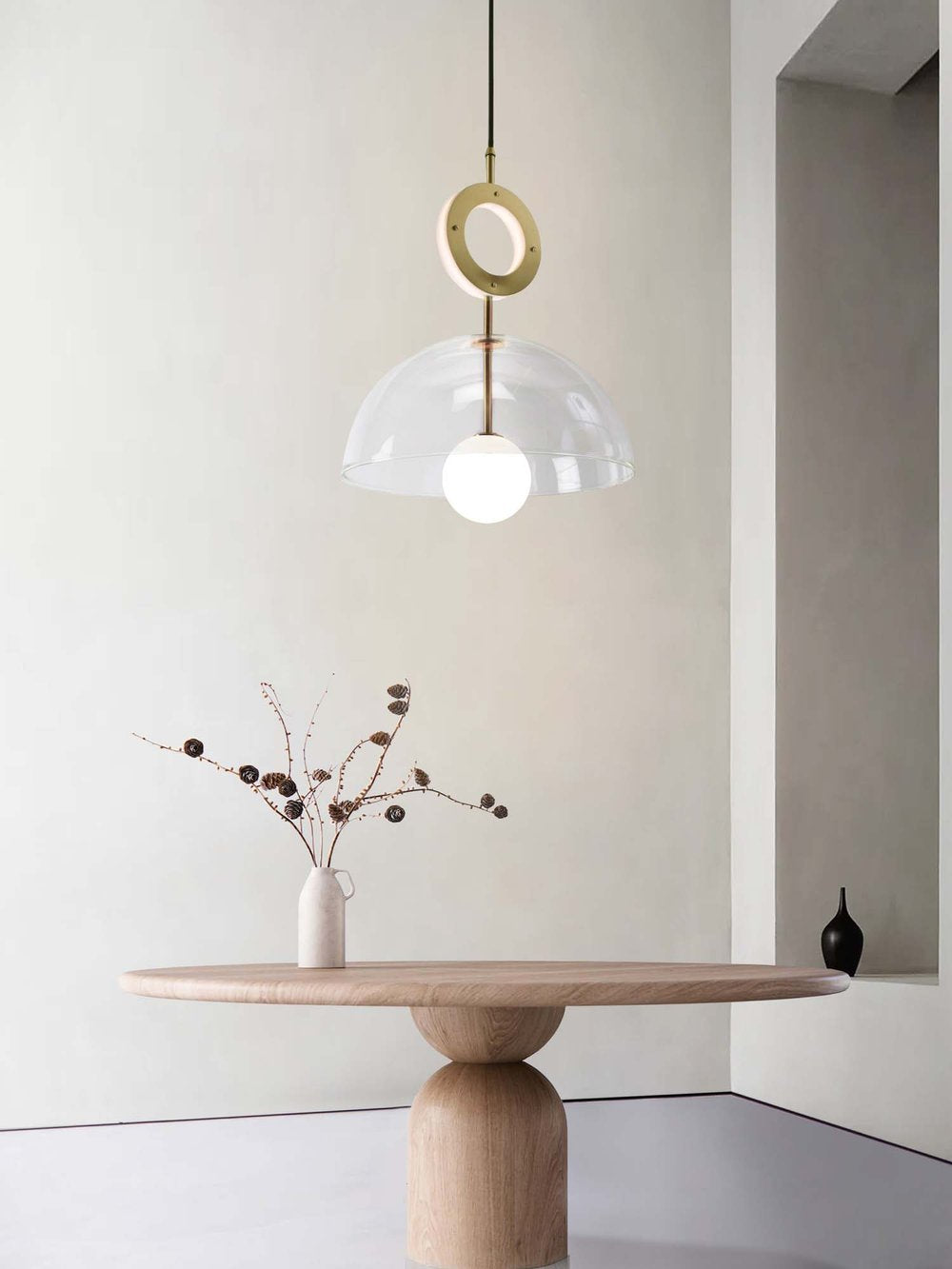 Deco Pendant and Ring Light, hanging above table in setting.