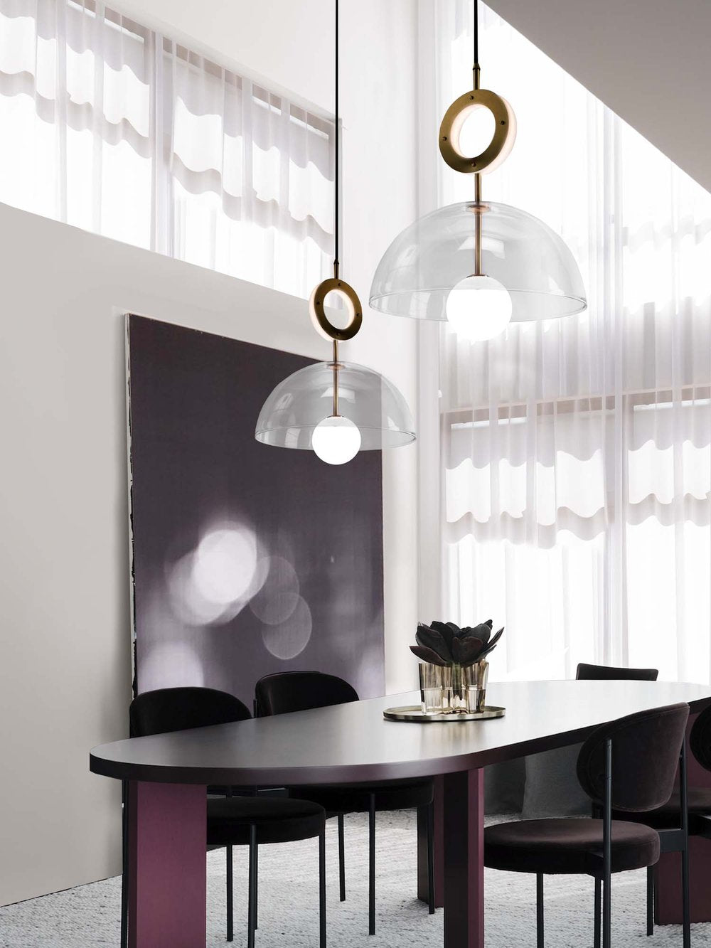 Deco Pendant and Ring Light, hanging above table in setting.