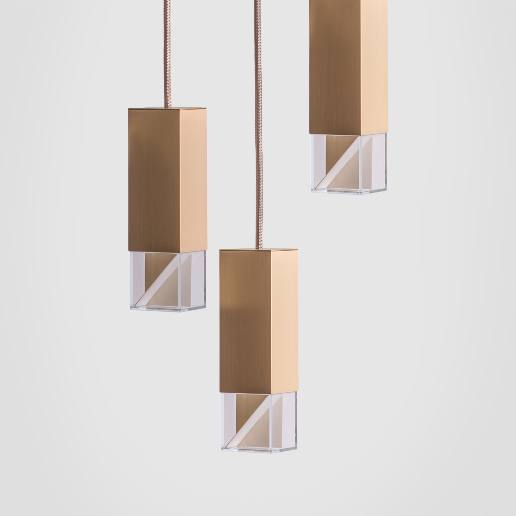 Lamp/ One Brass Trio Chandelier grey background close up