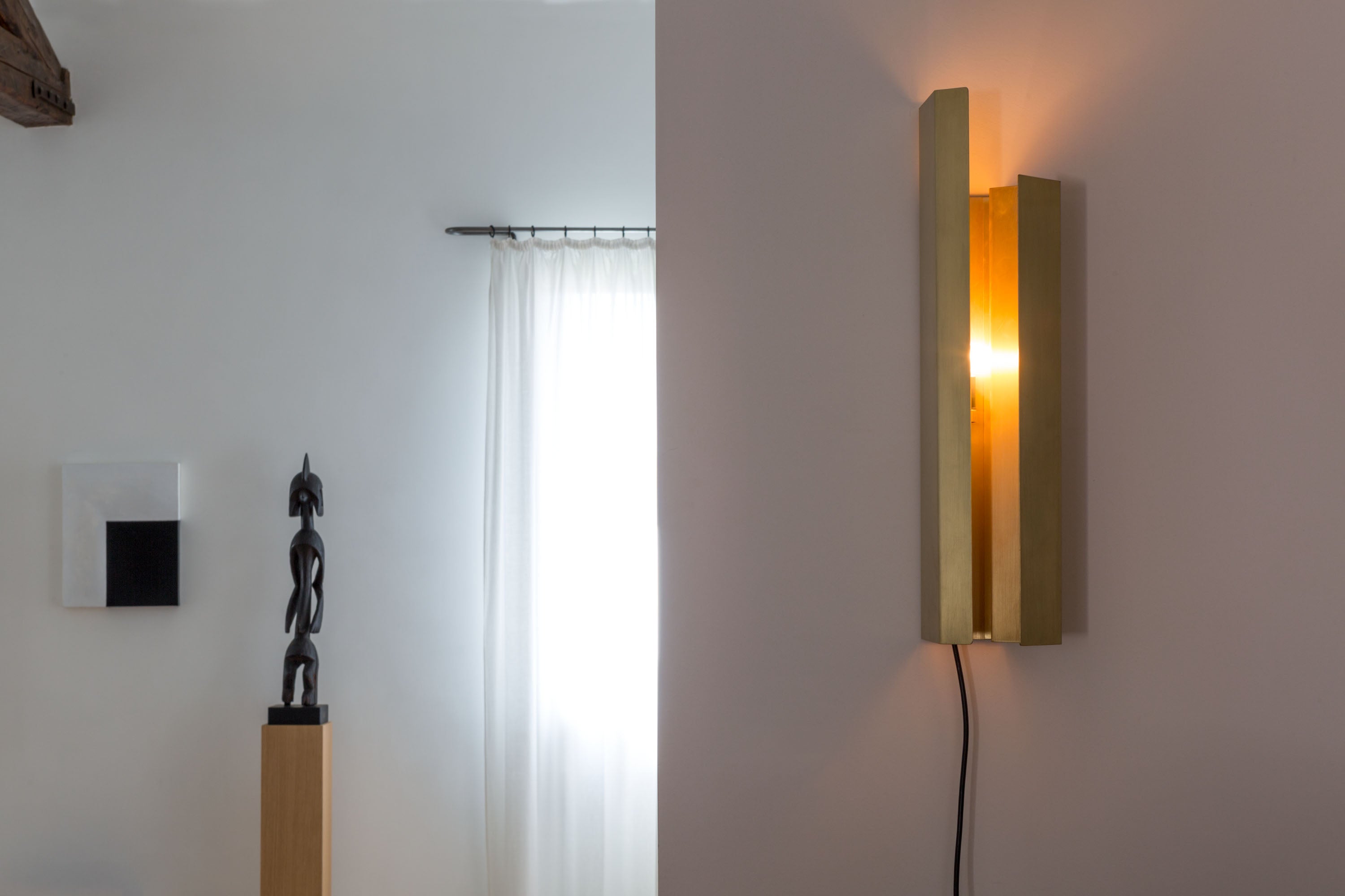 Piega Wall Light, in setting, on.