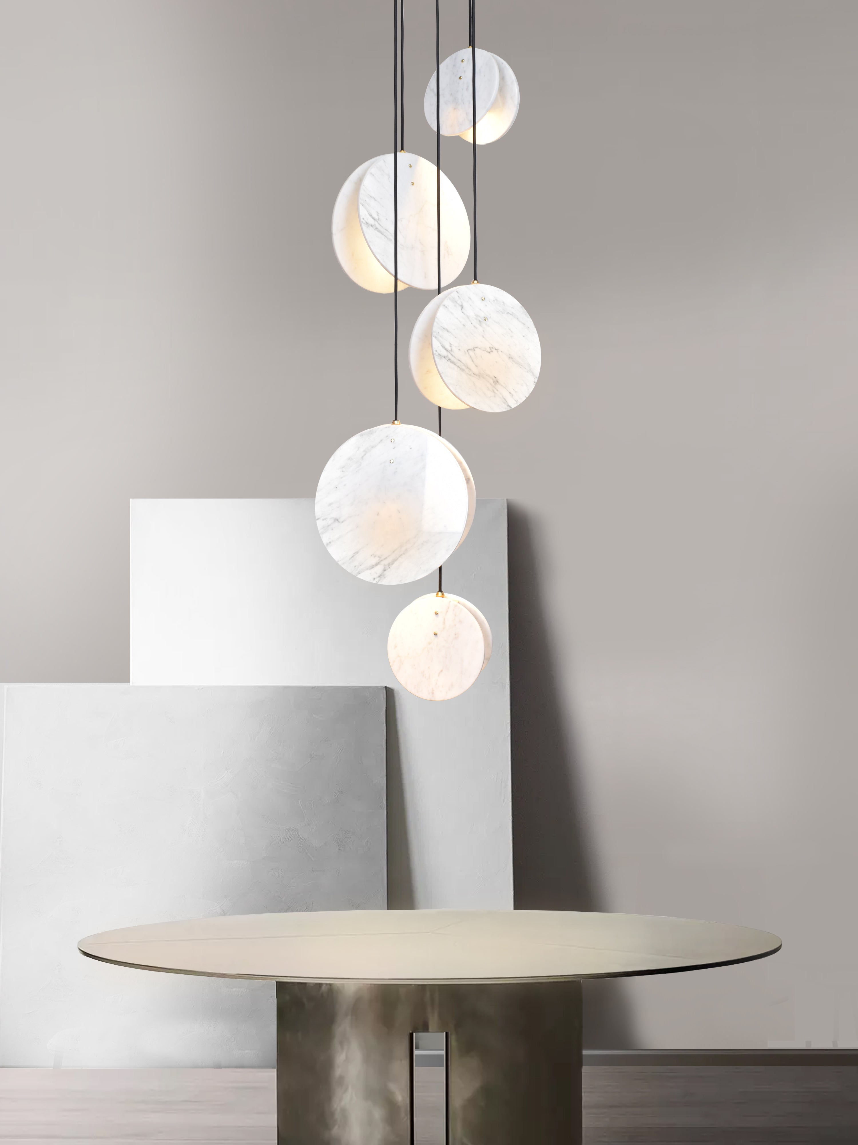 Shell 5 Light, hanging from ceiling above table in setting.