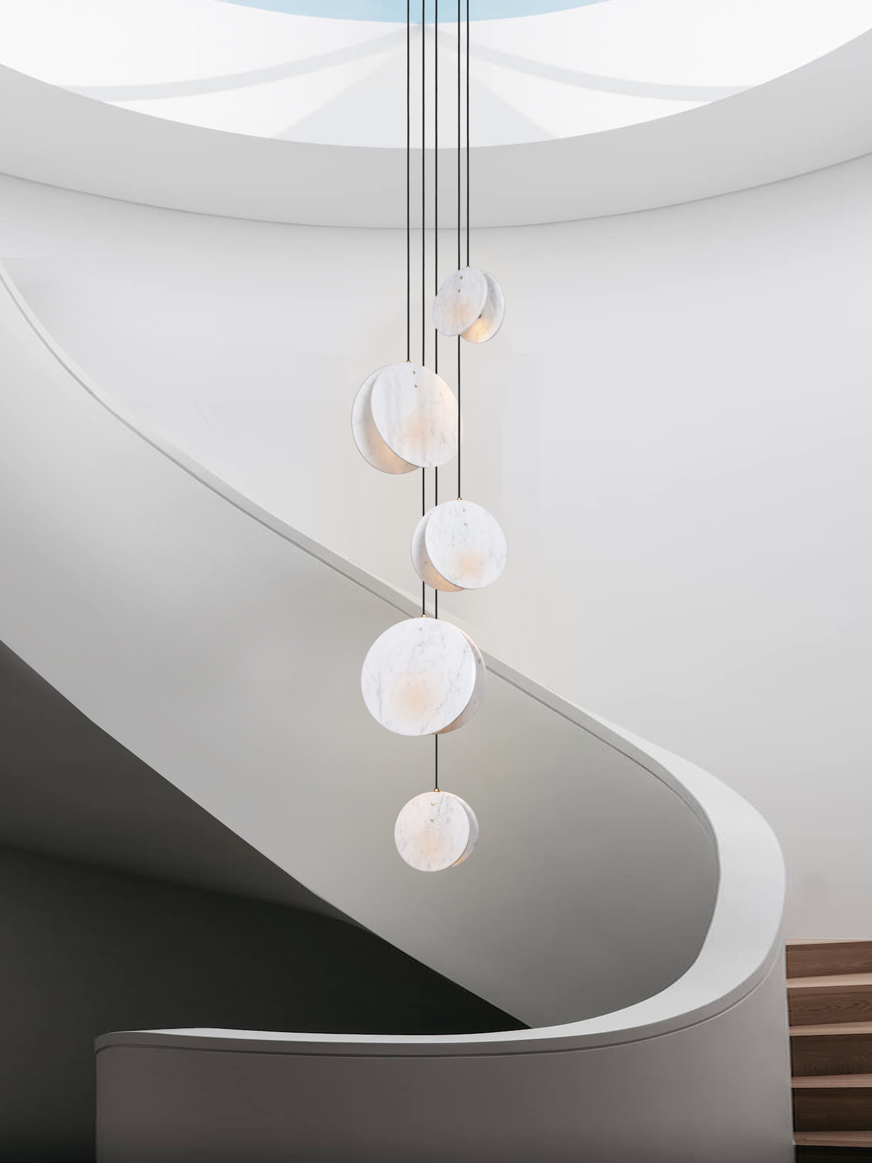 Shell 5 Light, hanging from ceiling above stairs.