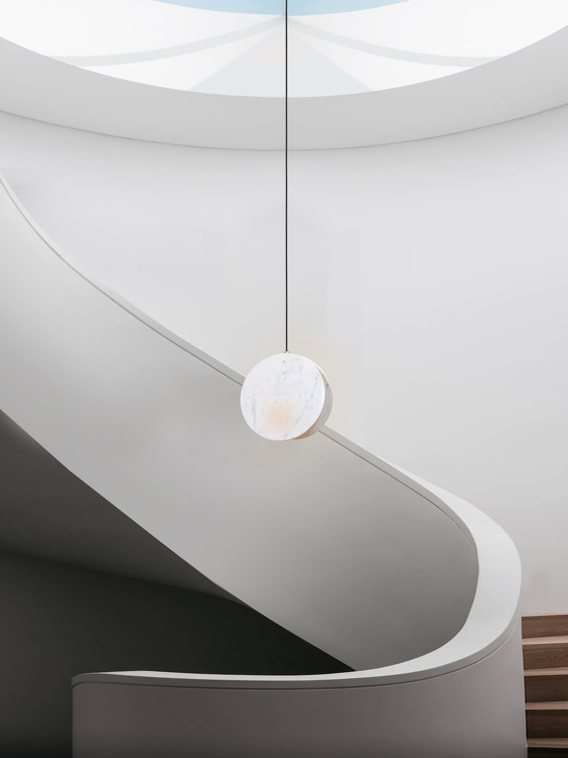 Shell Pendant Light, hanging from ceiling in setting above stairs.