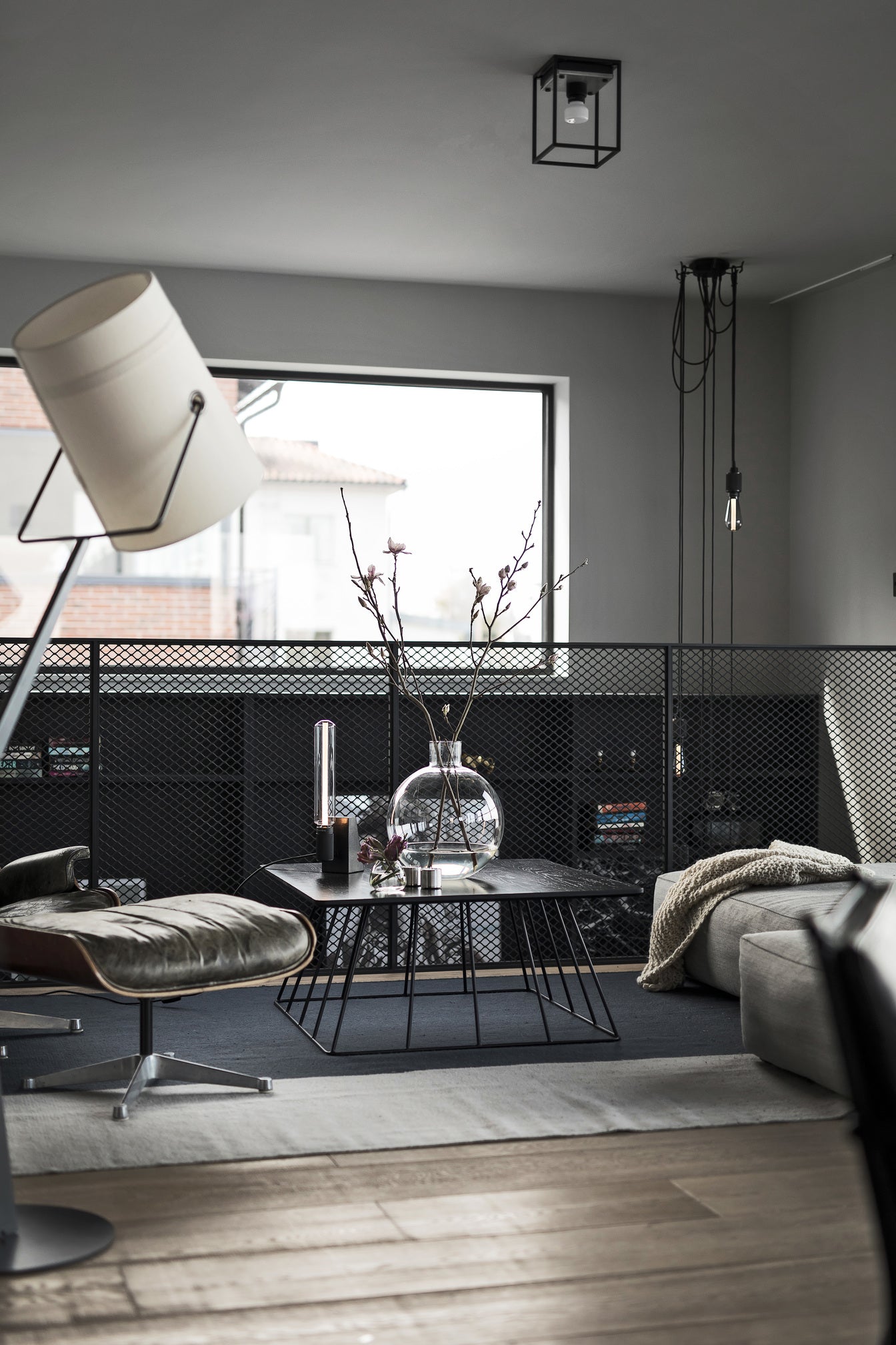 Caged Ceiling Light / Small in black marble, on ceiling in setting.