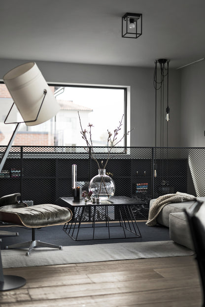Caged Ceiling Light / Small in black marble, on ceiling in setting.