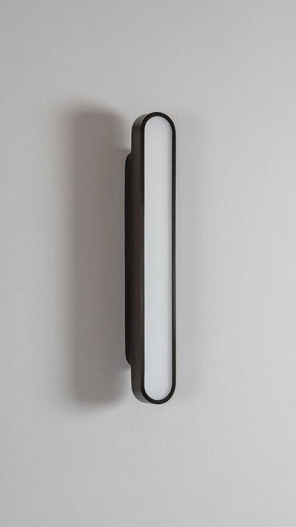 Capsule Wall Light dark bronze, front view.