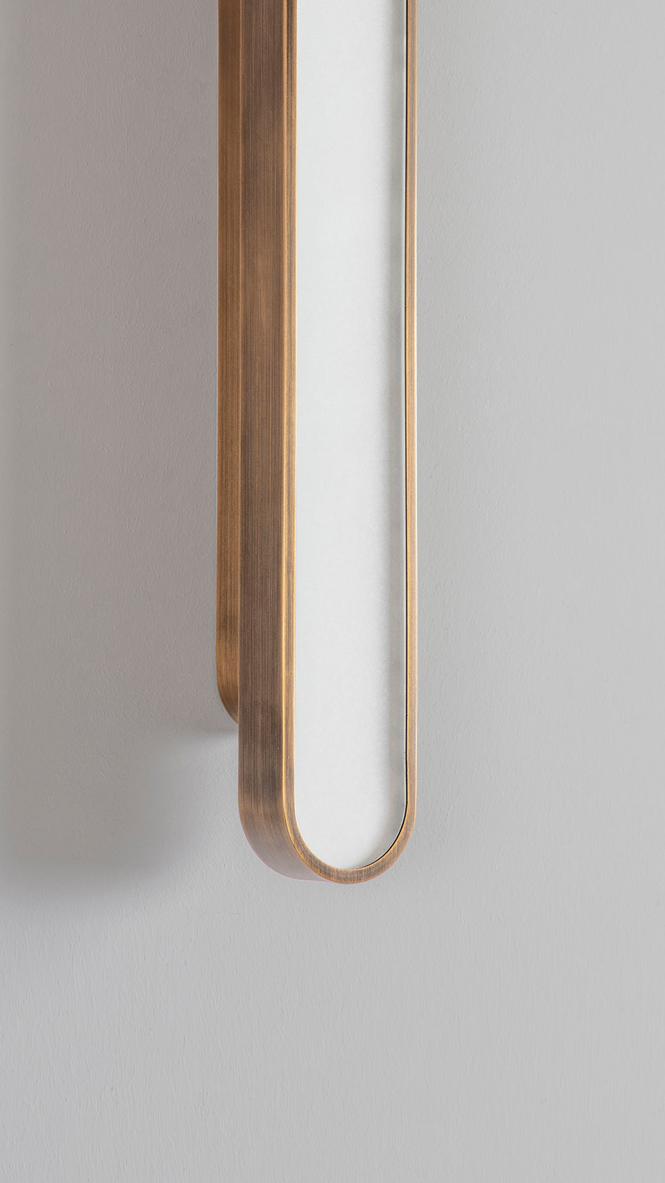 Capsule Wall Light bronze, detailed close up view of finish, on