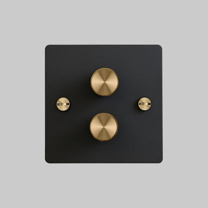 2G Dimmer/ 100W/ Black with brass details, front view.